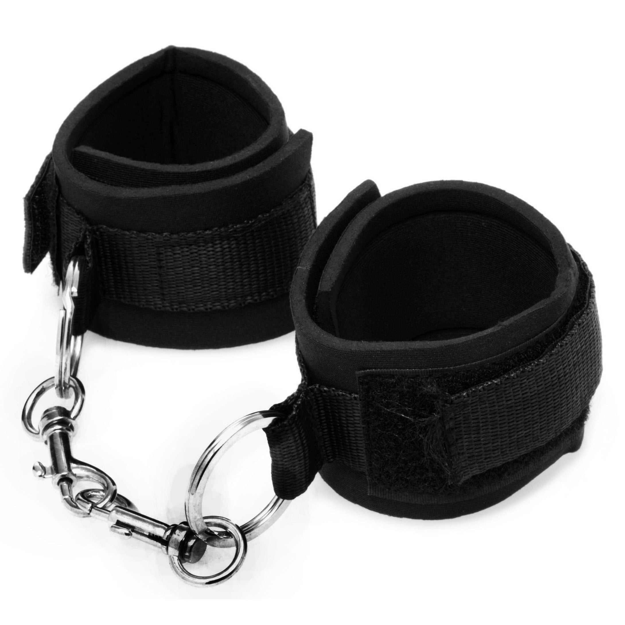 Black leather wristlet cuffs connected by a metal chain on a white background