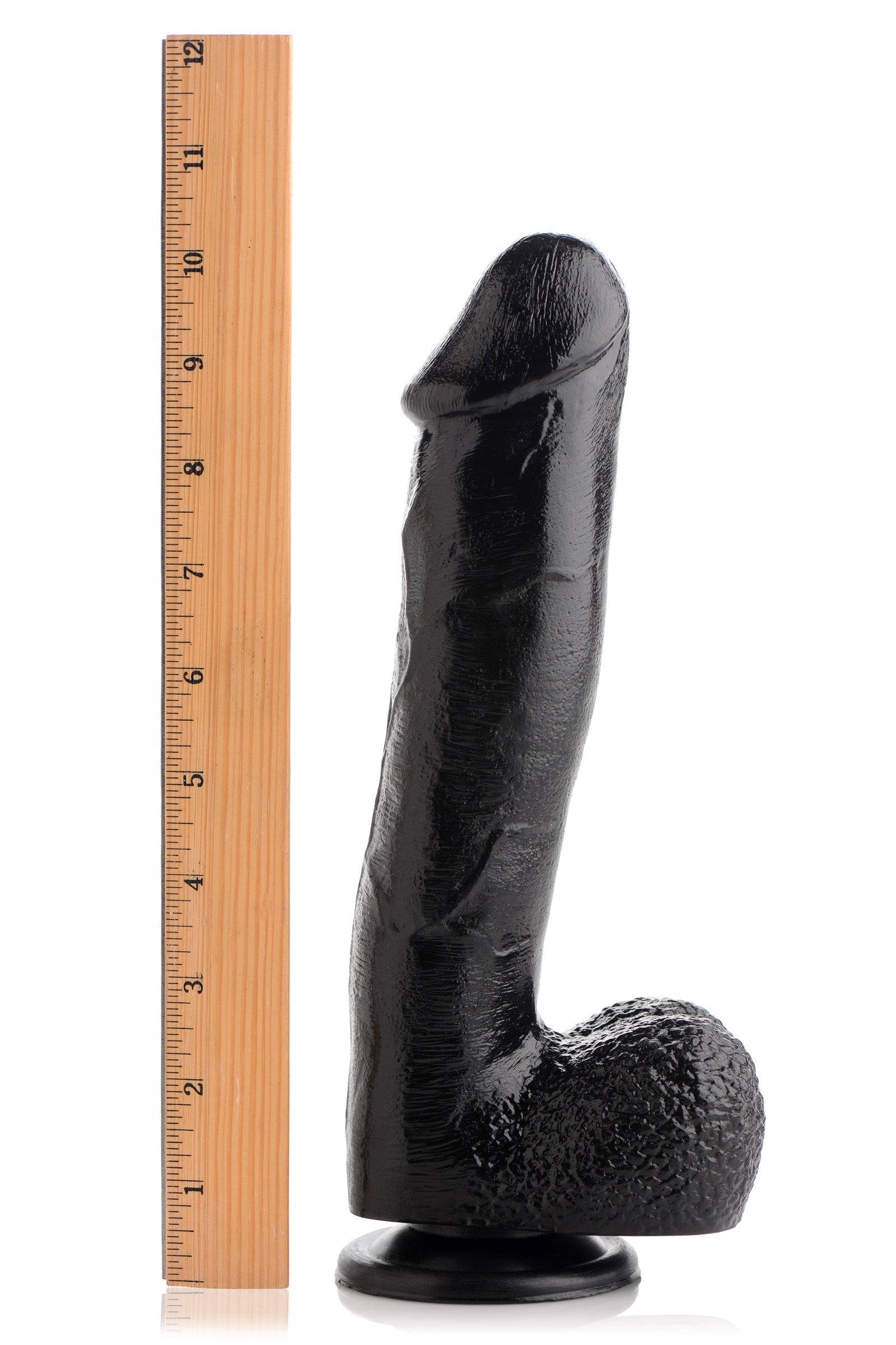 Mighty Midnight 10 inch dildo displayed next to a ruler for size reference