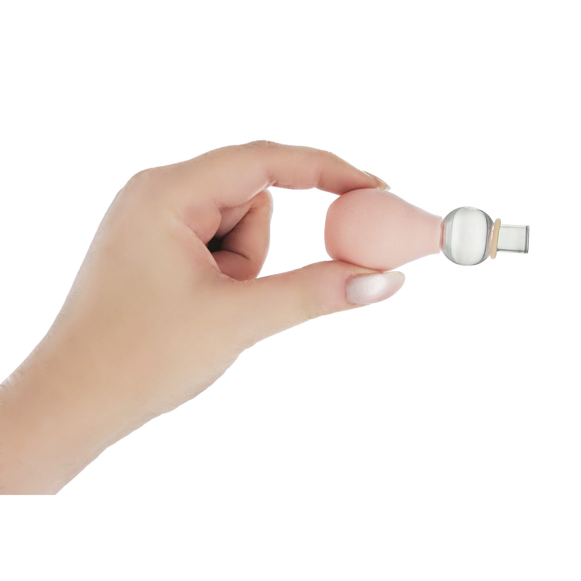 A hand demonstrating the Perfect Fit Nipple Enlarger on a white background