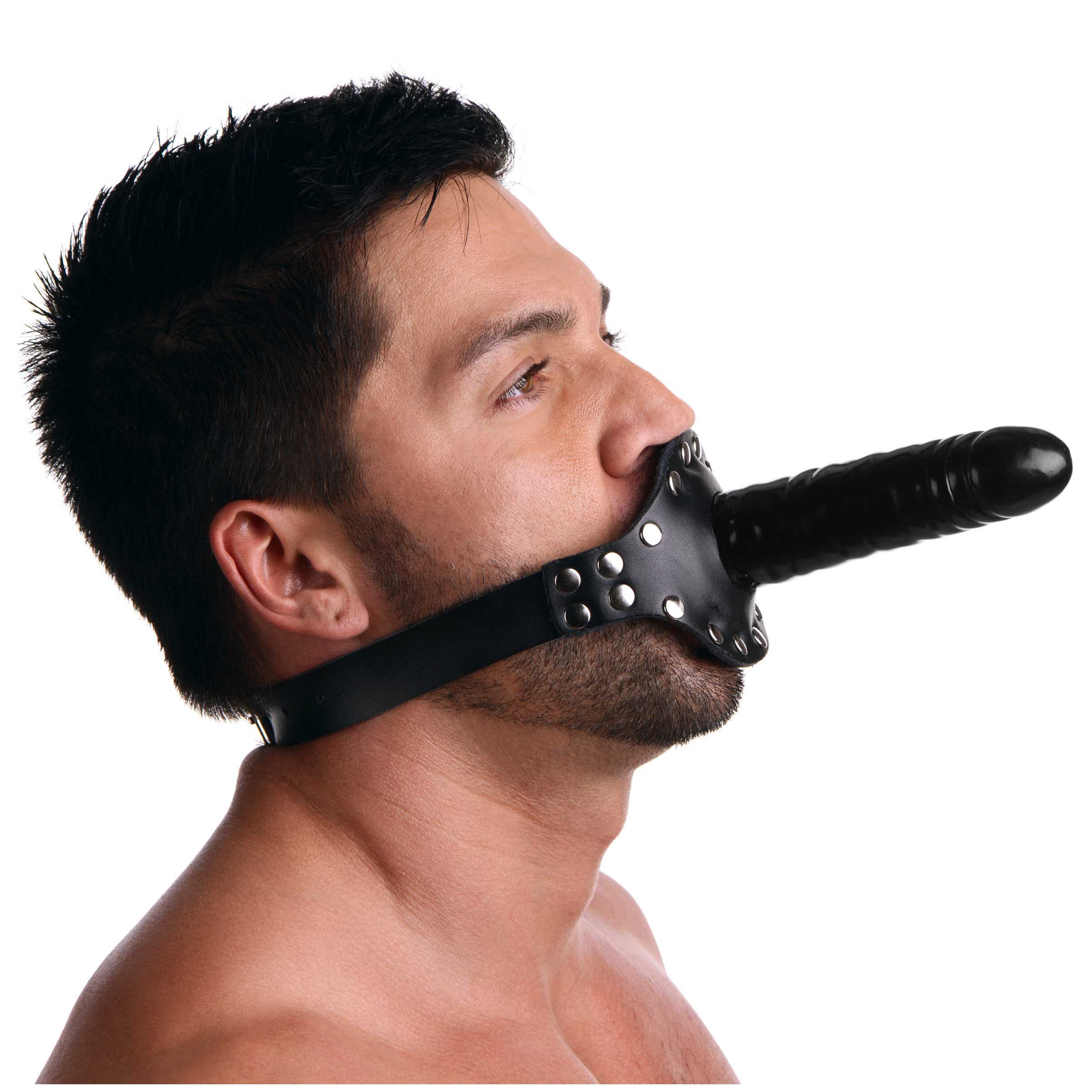 A person's mouth fitted with a black leather gag with strap