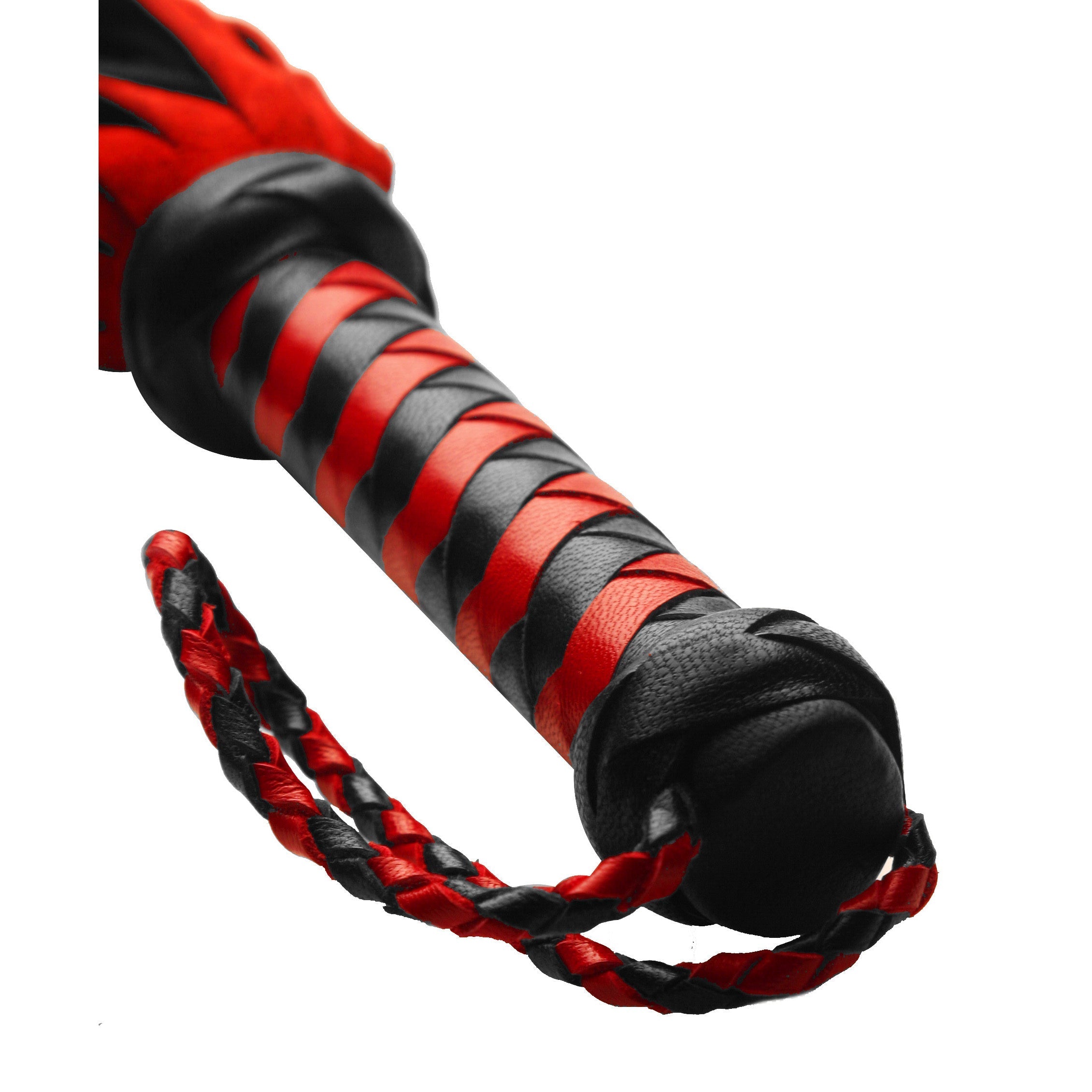 Detail of the woven handle and suede tails of a red and black short flogger