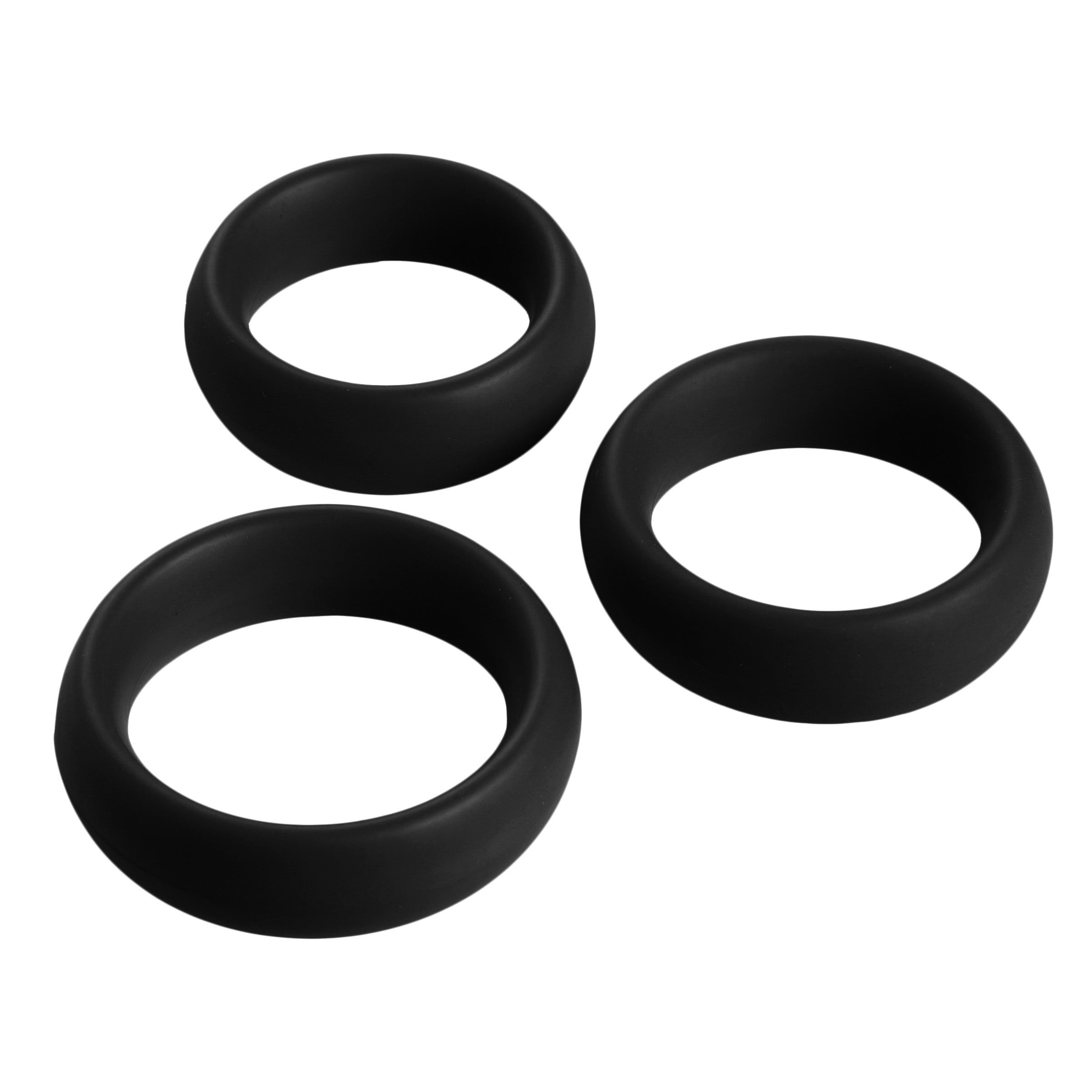 Three silicone cock rings for men, isolated on a white surface