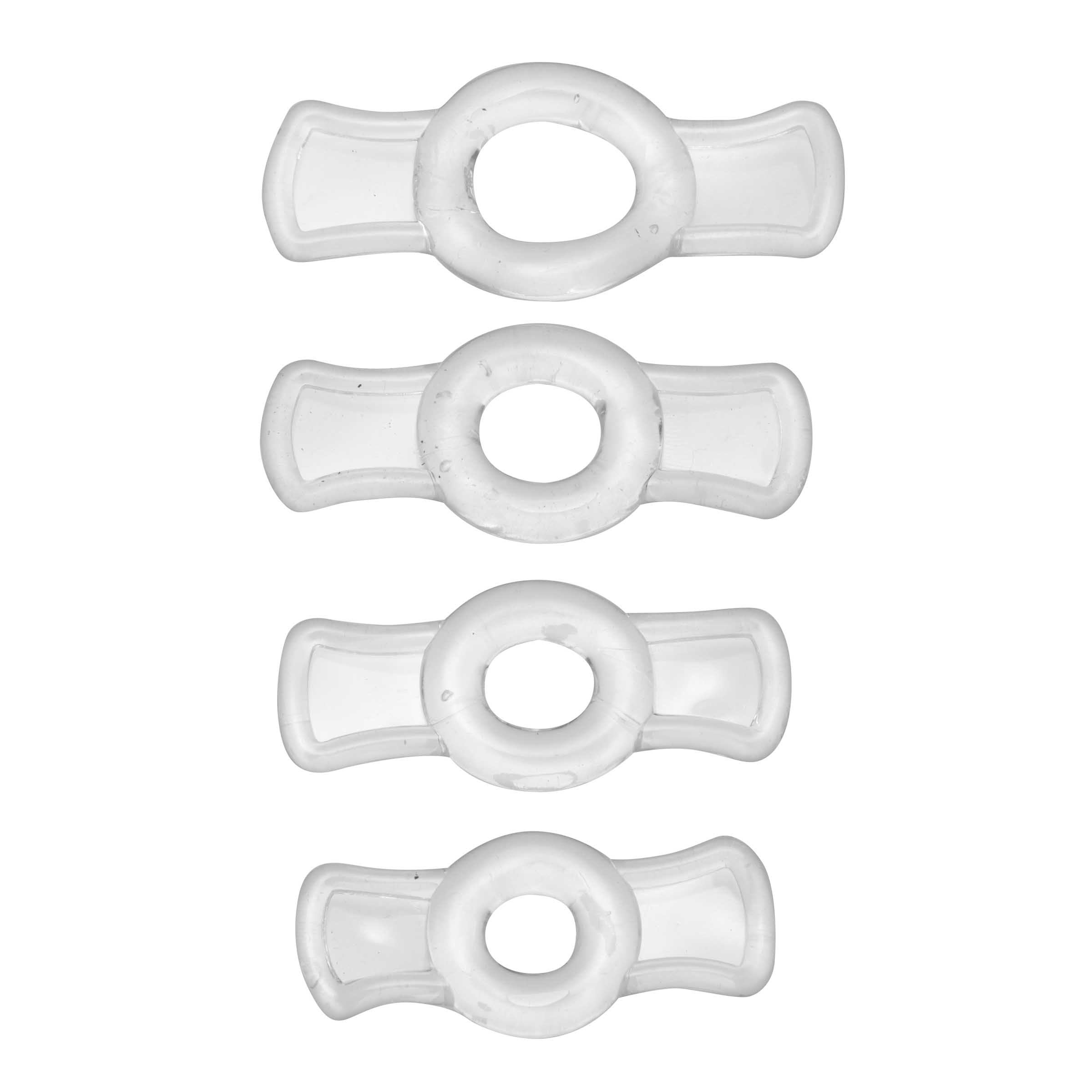 Multiple clear penis rings from the endurance set arranged on a white surface