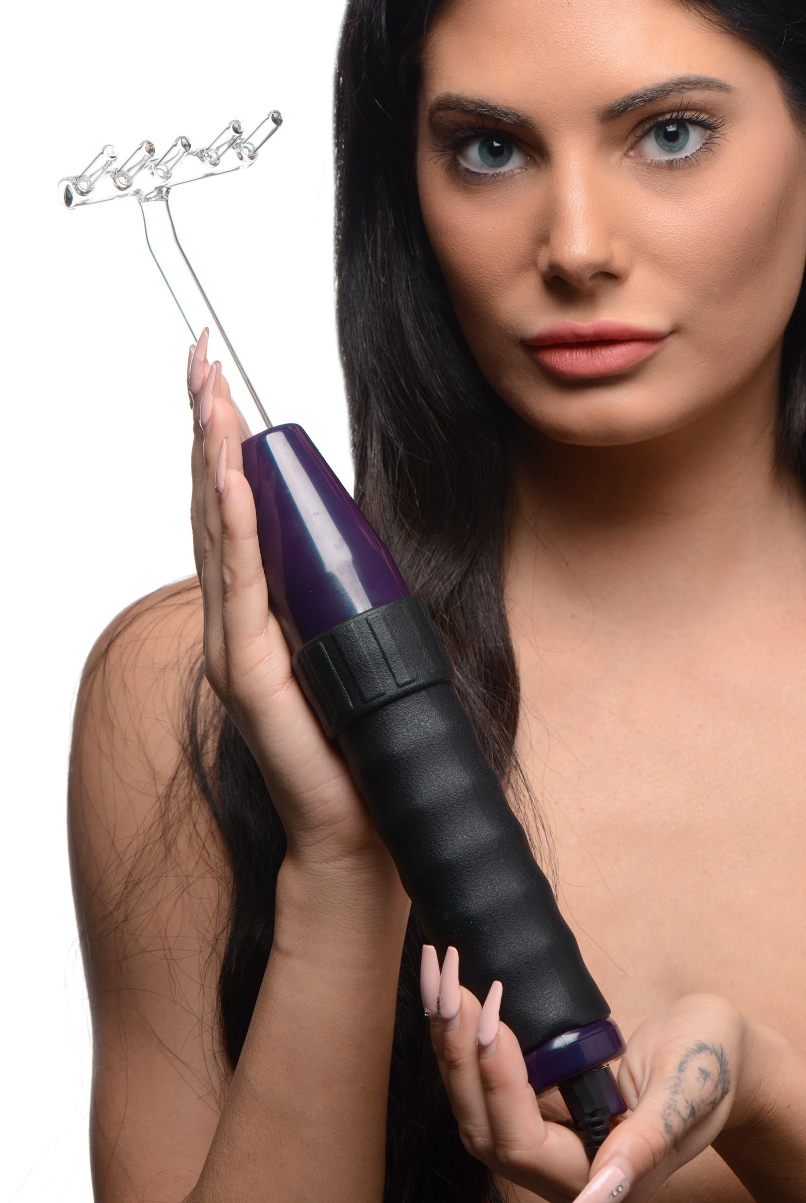 A person demonstrating the use of the Zeus Deluxeion Twilight Violet Wand