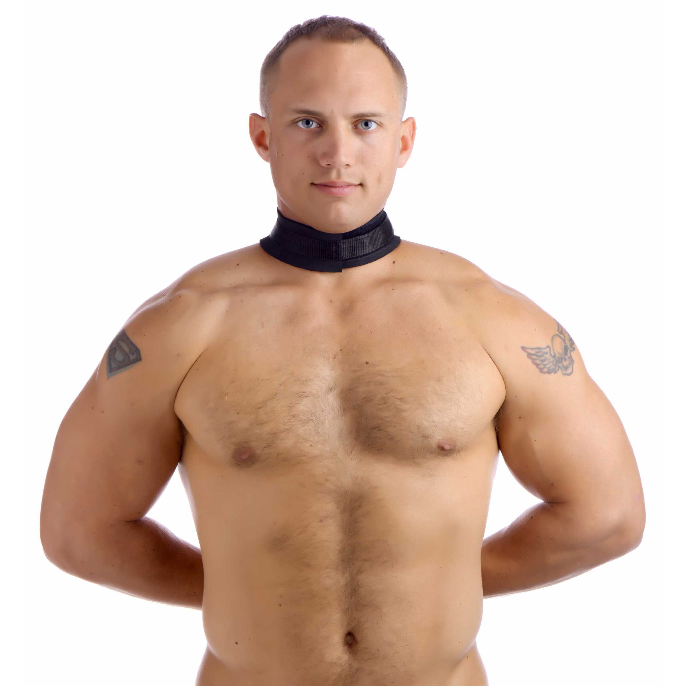 Neoprene collar to wrist restraint strap being modeled by a person without a shirt