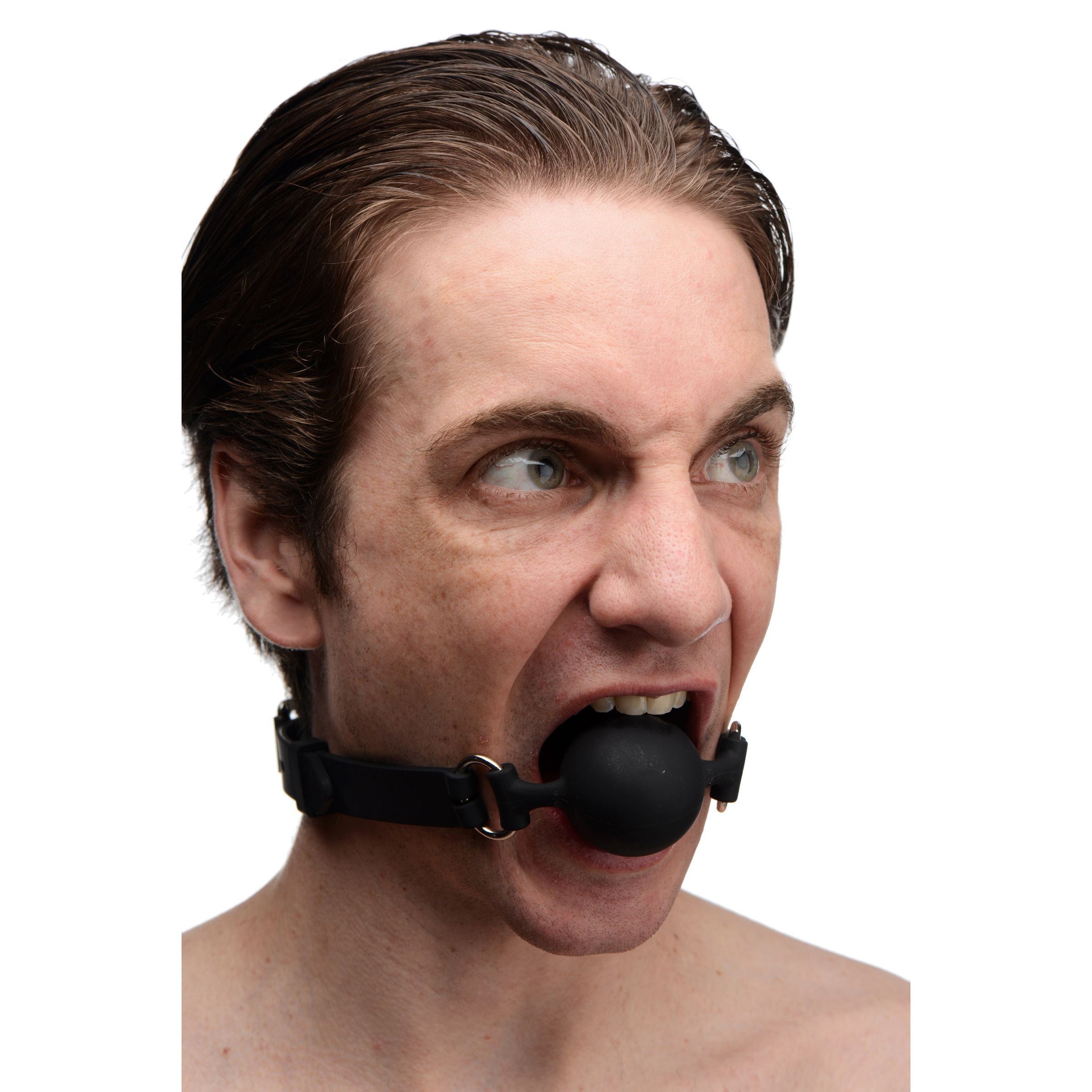 Individual with a black silicone ball gag secured in mouth