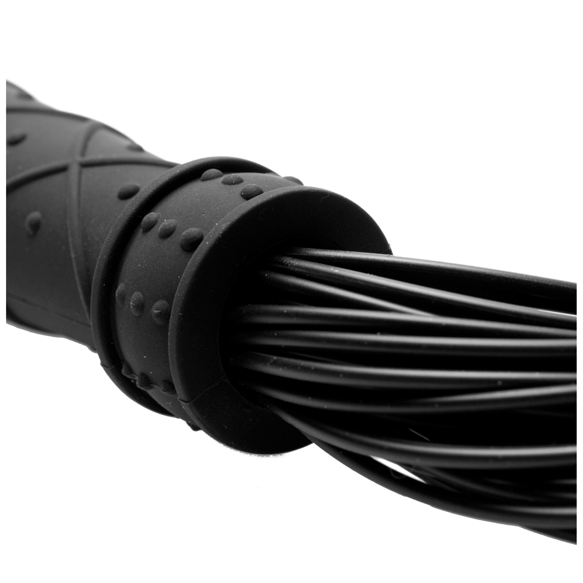 Close-up view of a black silicone flogger with a sturdy handle