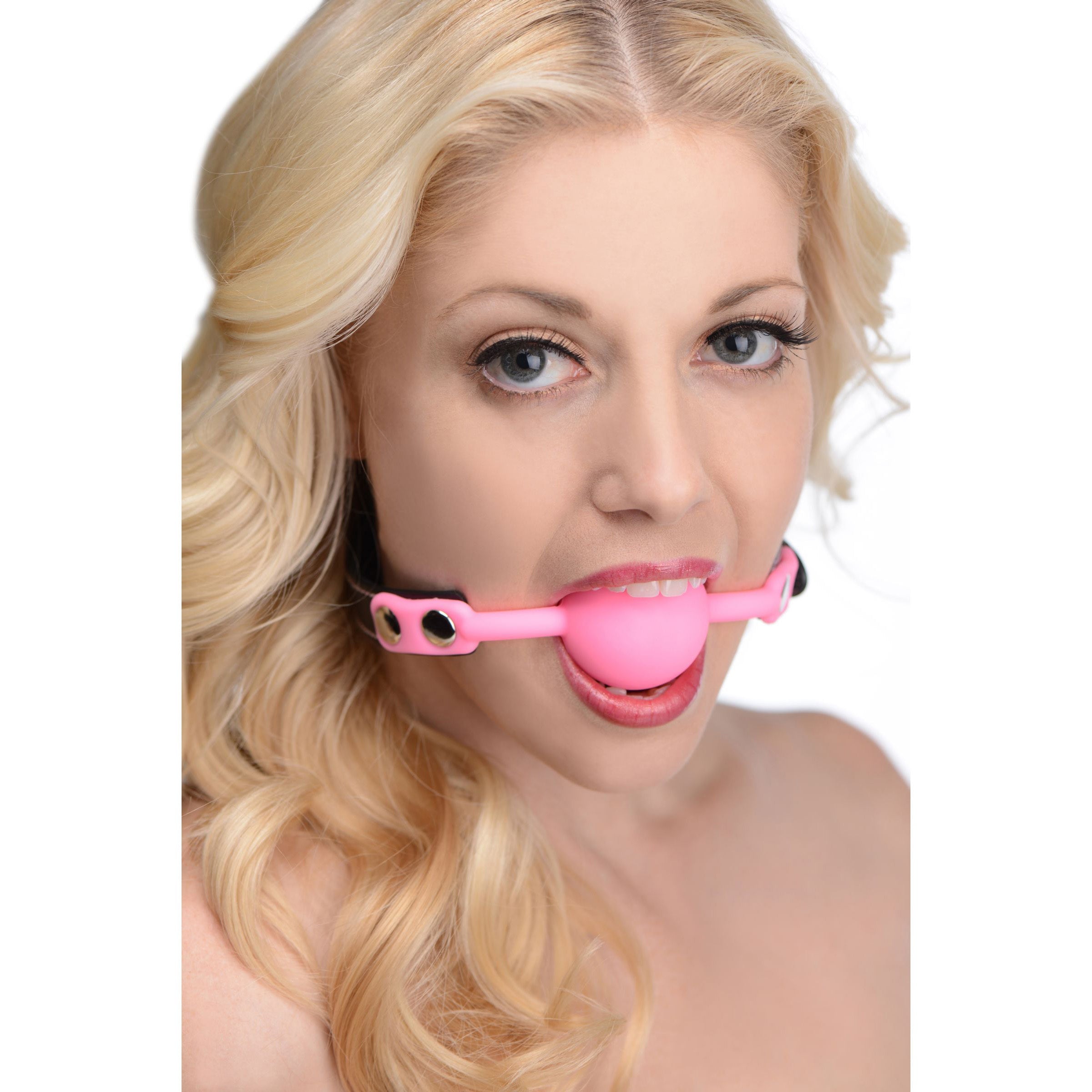 Person demonstrating the use of the Glow Gag glow-in-the-dark silicone ball gag