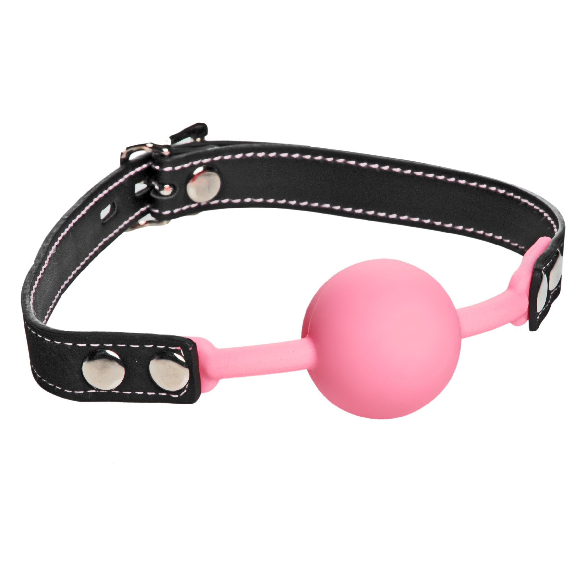 Detail of the Glow Gag featuring a pink silicone ball attached to a black leather-like strap