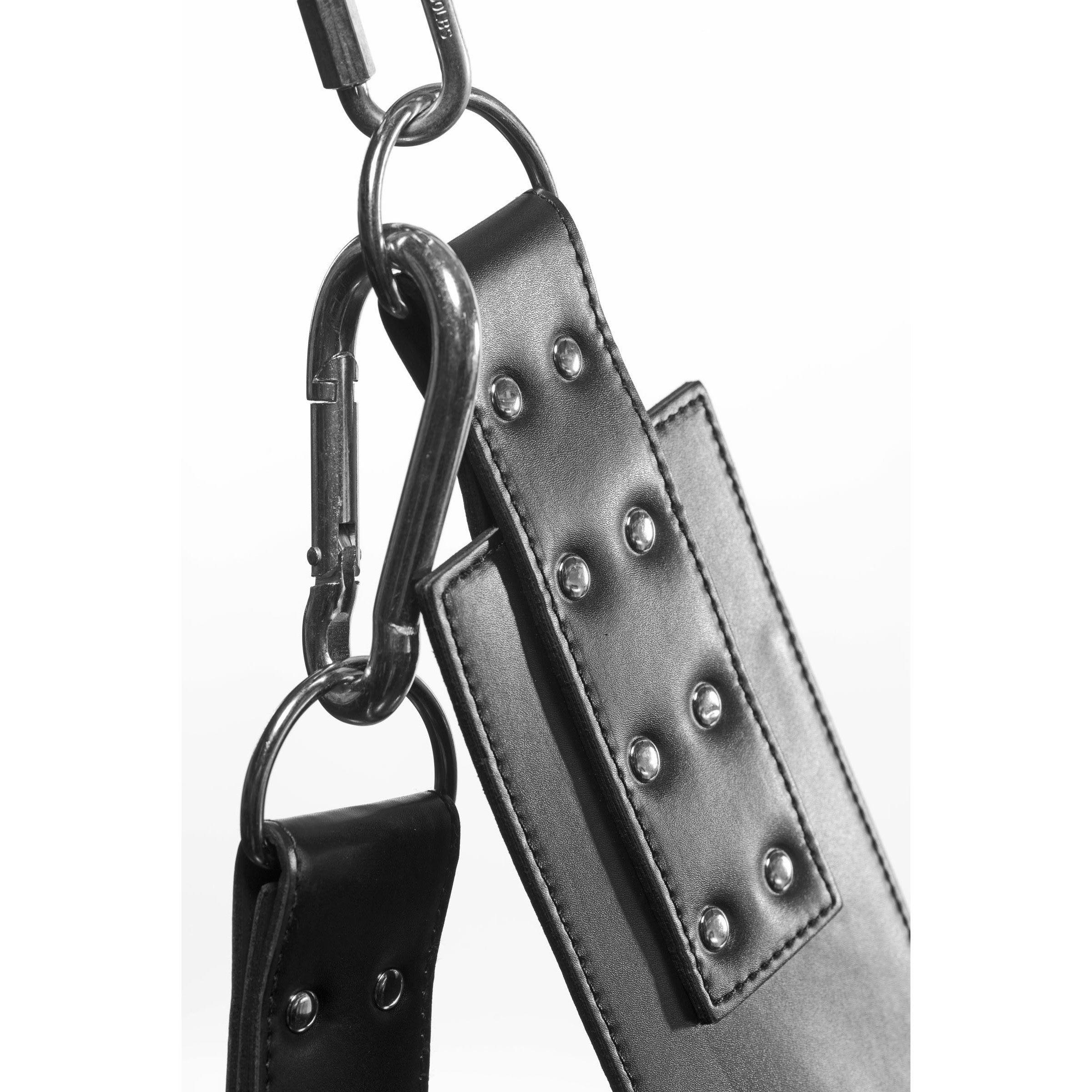 Extreme Sling's black leather strap adorned with metal studs for added aesthetics