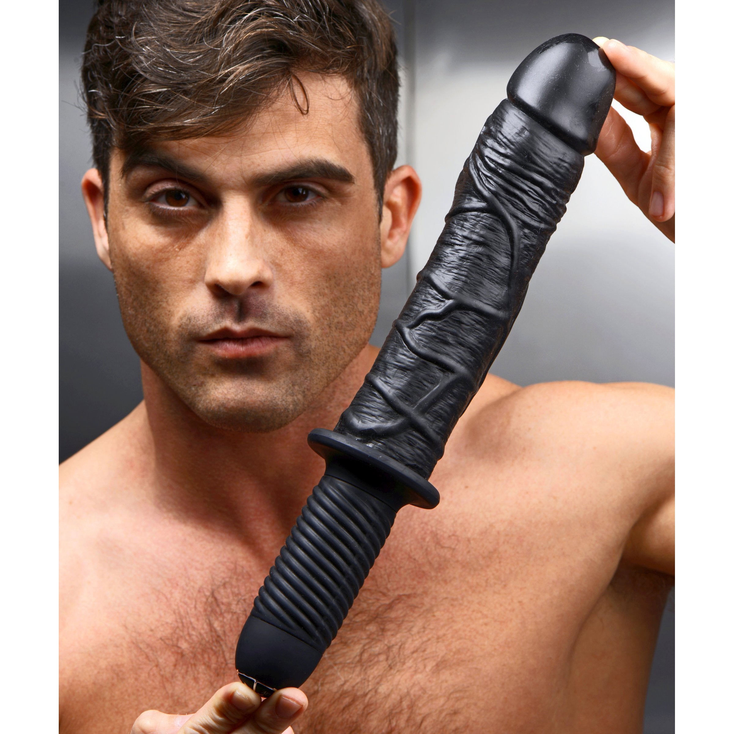 Person demonstrating the size of The Violator - 13 Mode XL Dildo Thruster