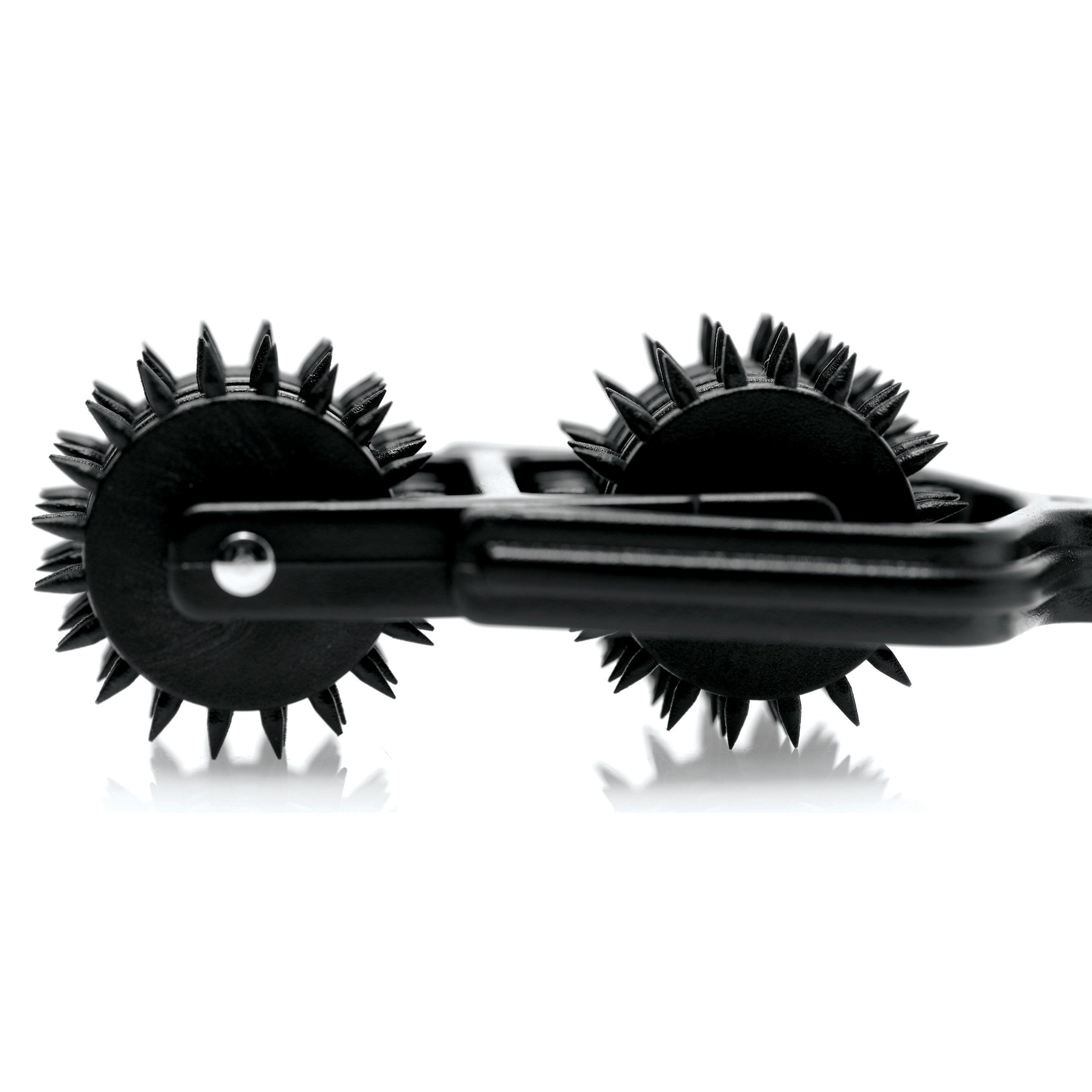 The tips of the Transfix Dual Pinwheel's spikes isolated against a white background