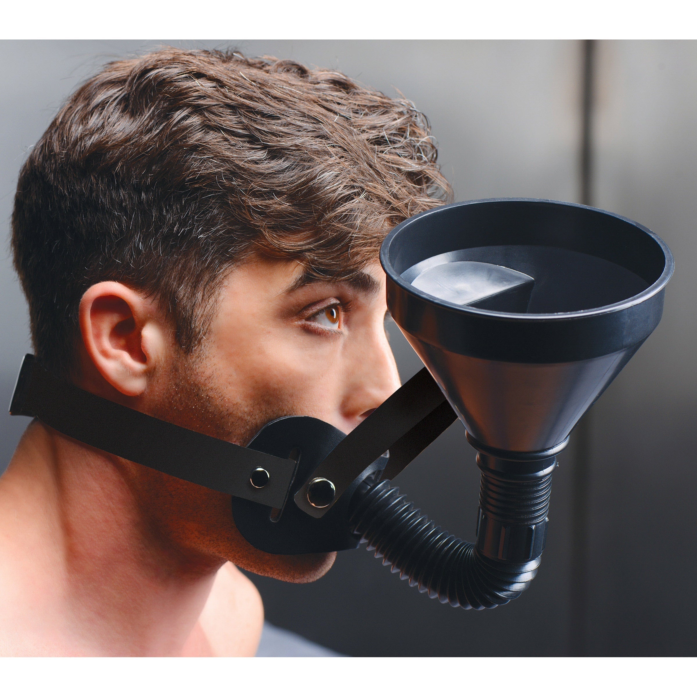 A model wearing a black funnel gag designed for fetish activities