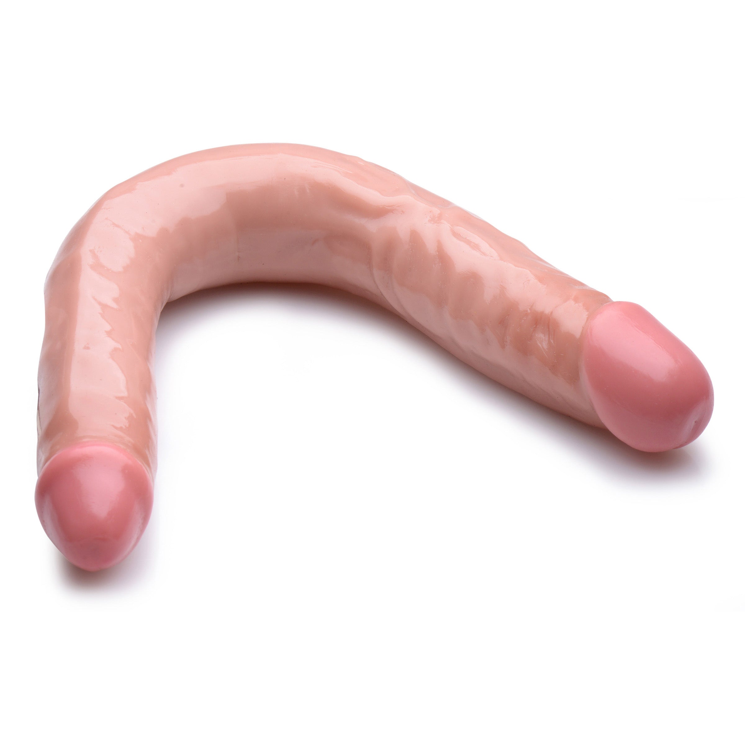 Realistic double-ended dildo in pink on a white background