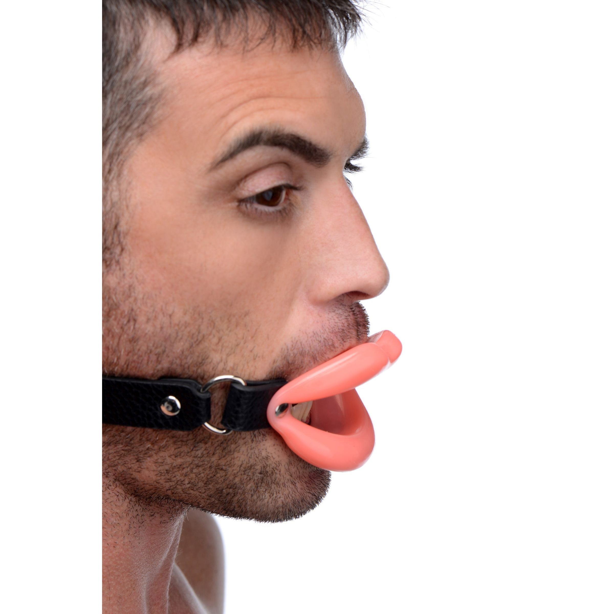 Individual wearing a sissy mouth gag with adjustable straps