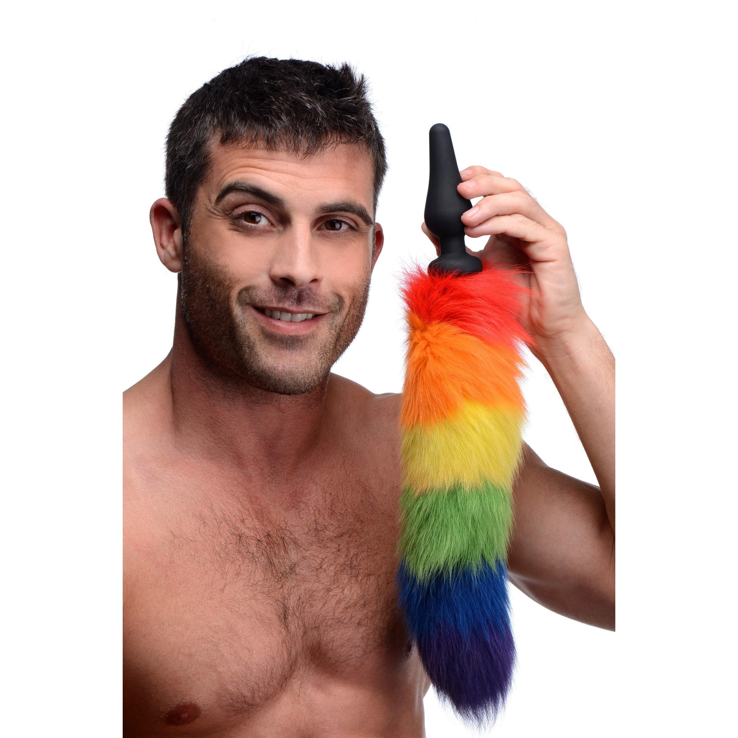 Person presenting the Rainbow Tail Anal Plug without revealing their identity