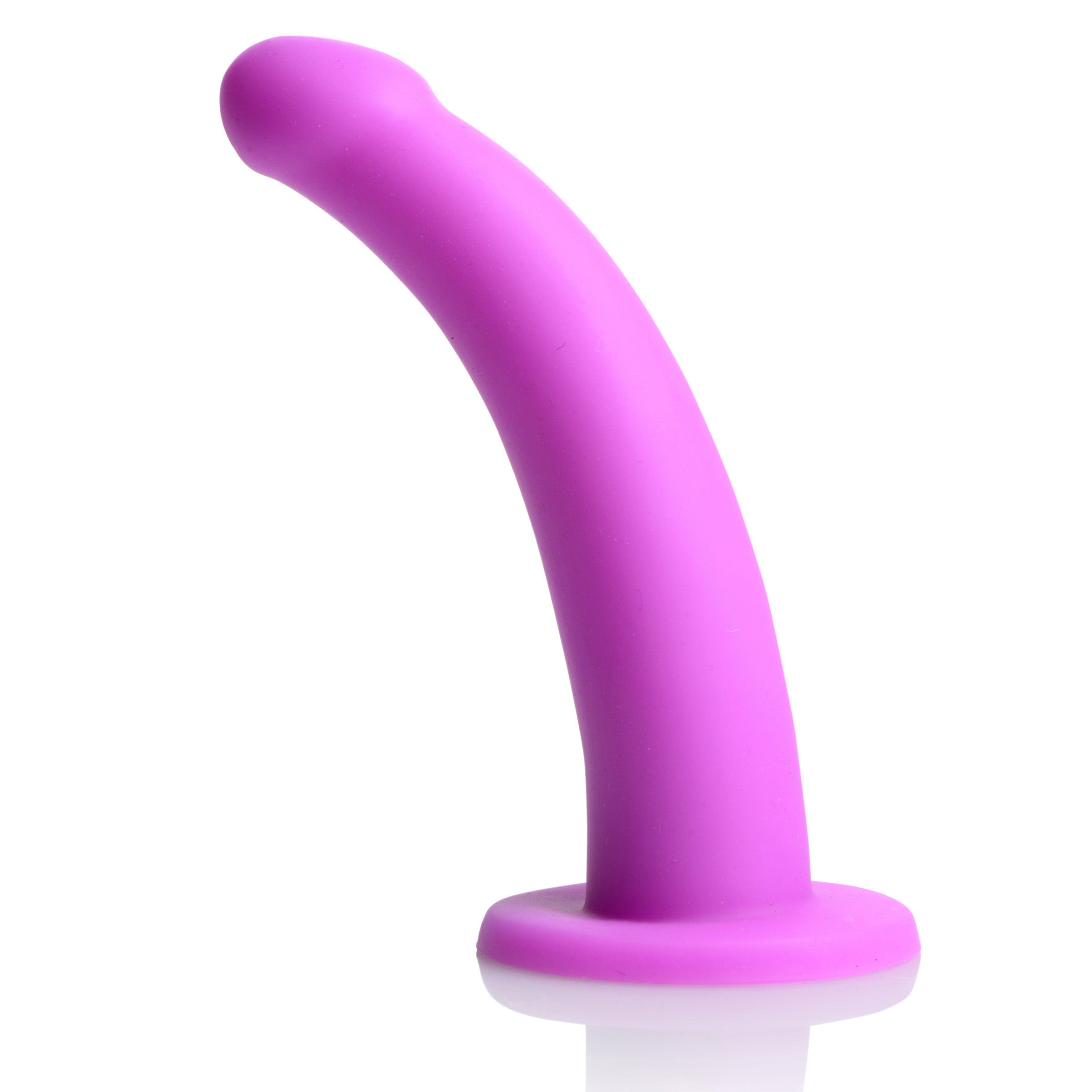 Silicone G-spot dildo with harness in purple against a white backdrop