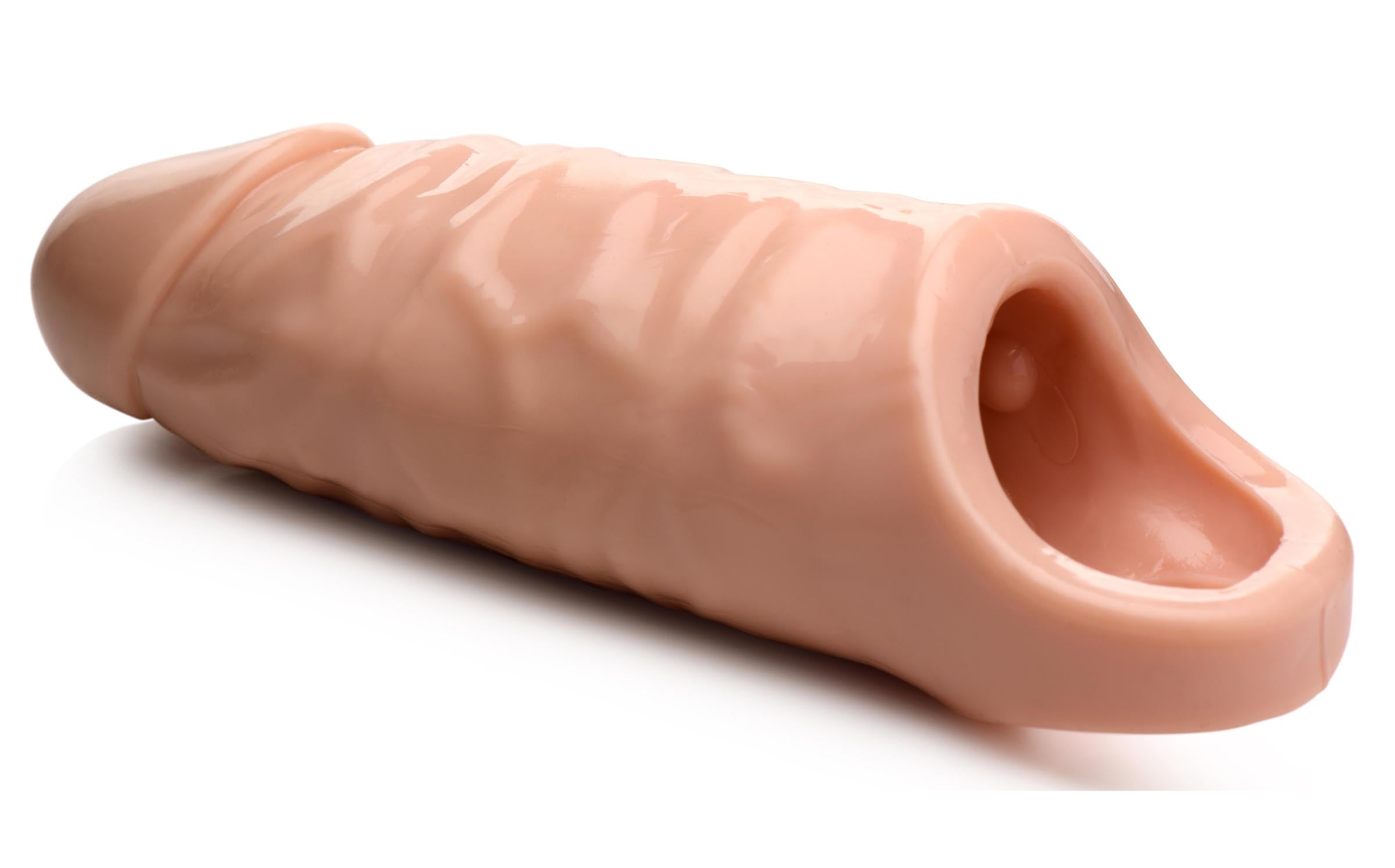 Side view of a 7-inch wide penis extension against a white backdrop