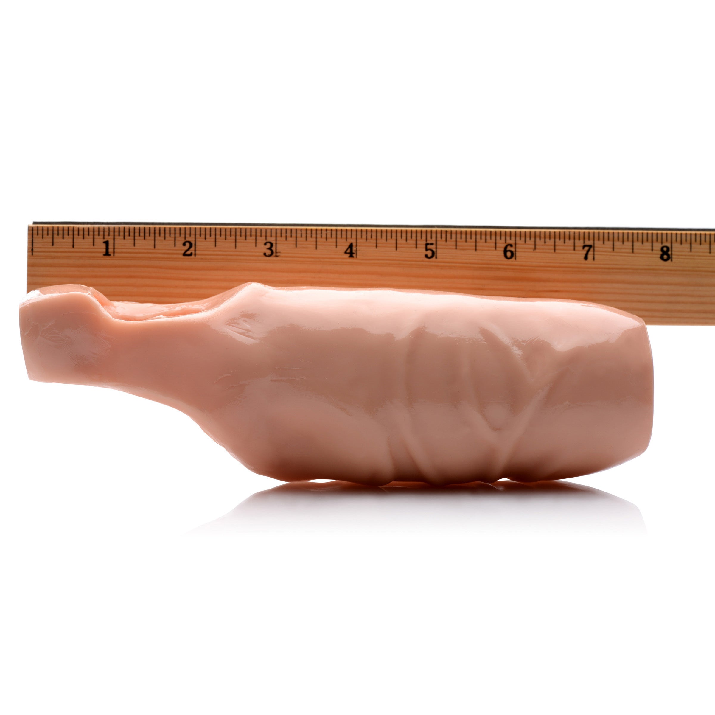 5 Inch Open Tip Penis Extension displayed beside a ruler for scale