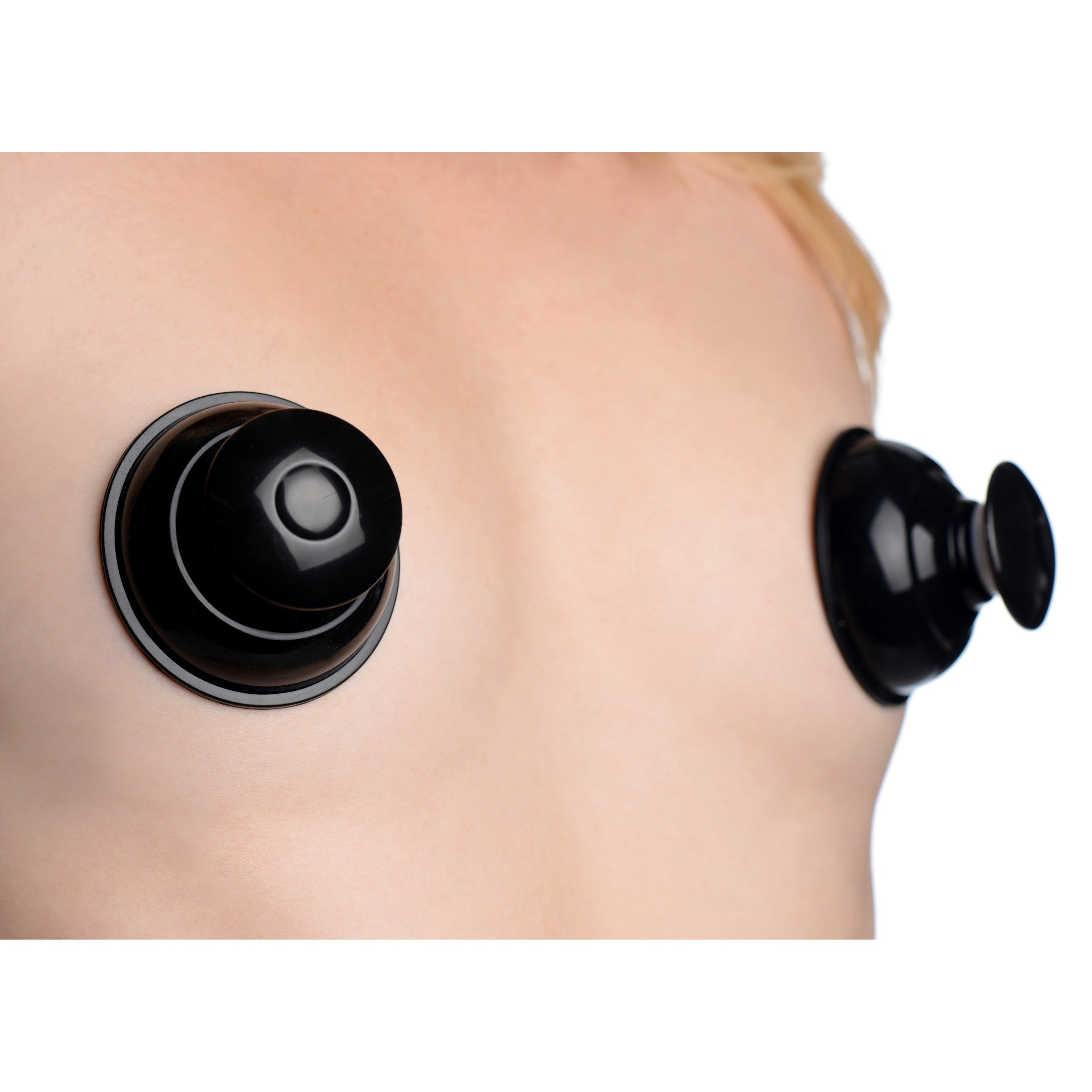 Close-up of black silicone nipple suction devices by Plungers