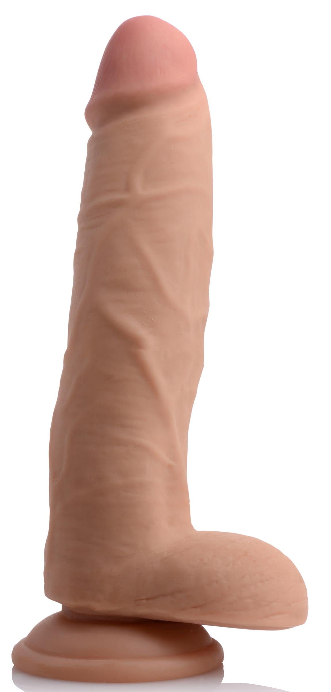 Silicone realistic dildo featuring a dual-layer design, isolated on white