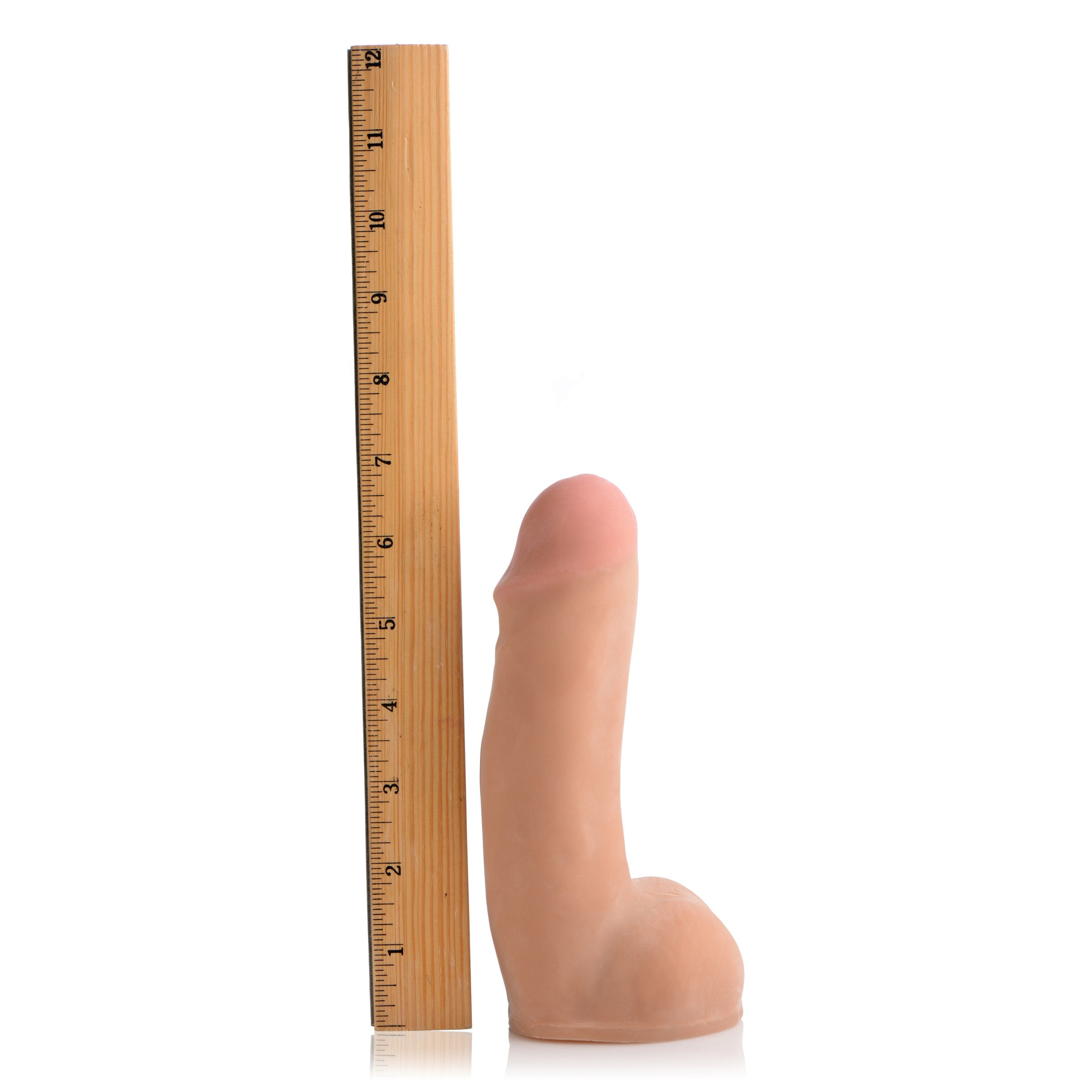 The Dual Density Squirting Dildo positioned upright next to a ruler for size reference