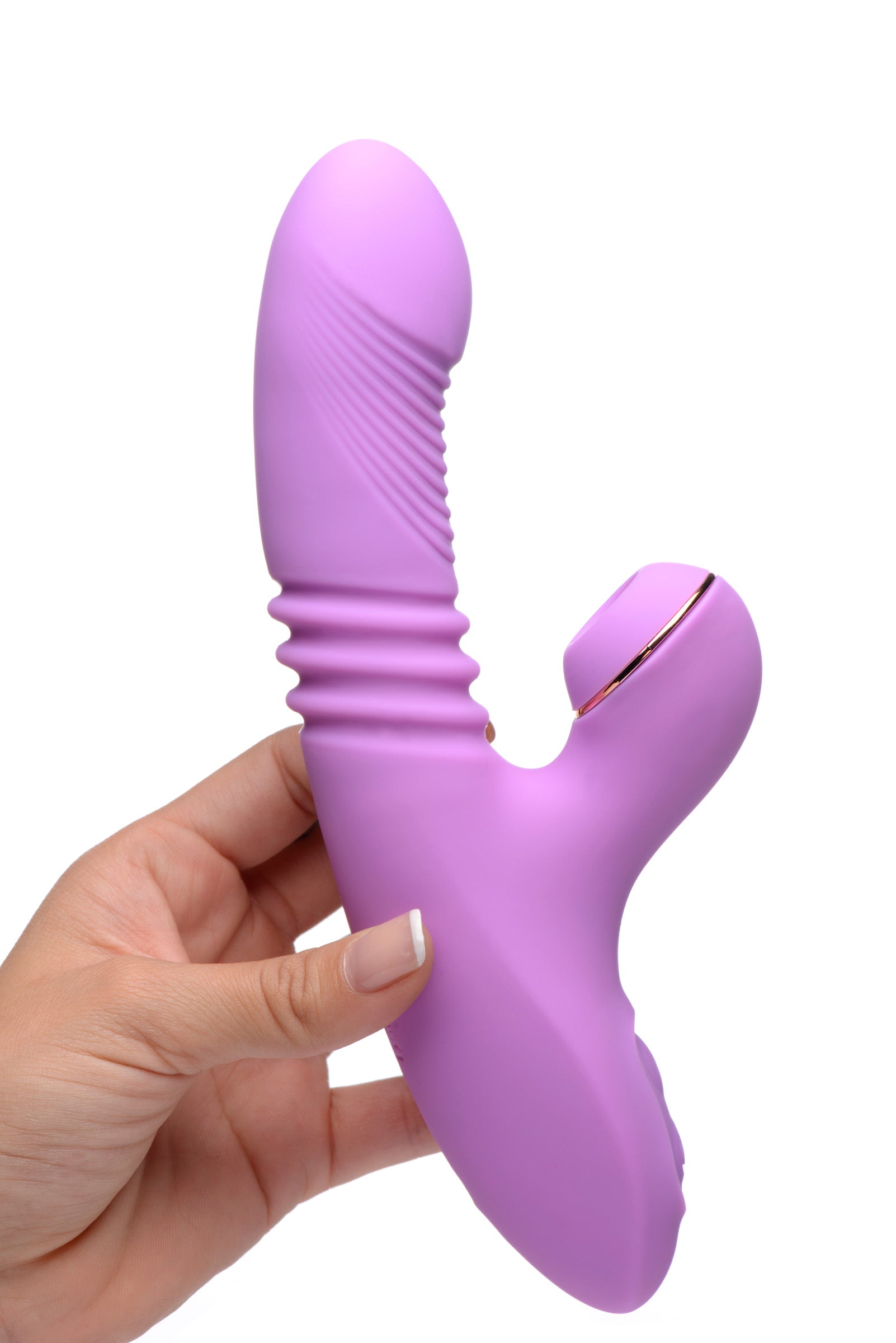 Close-up of a woman's hand holding the Shegasm Thrusting Suction Rabbit