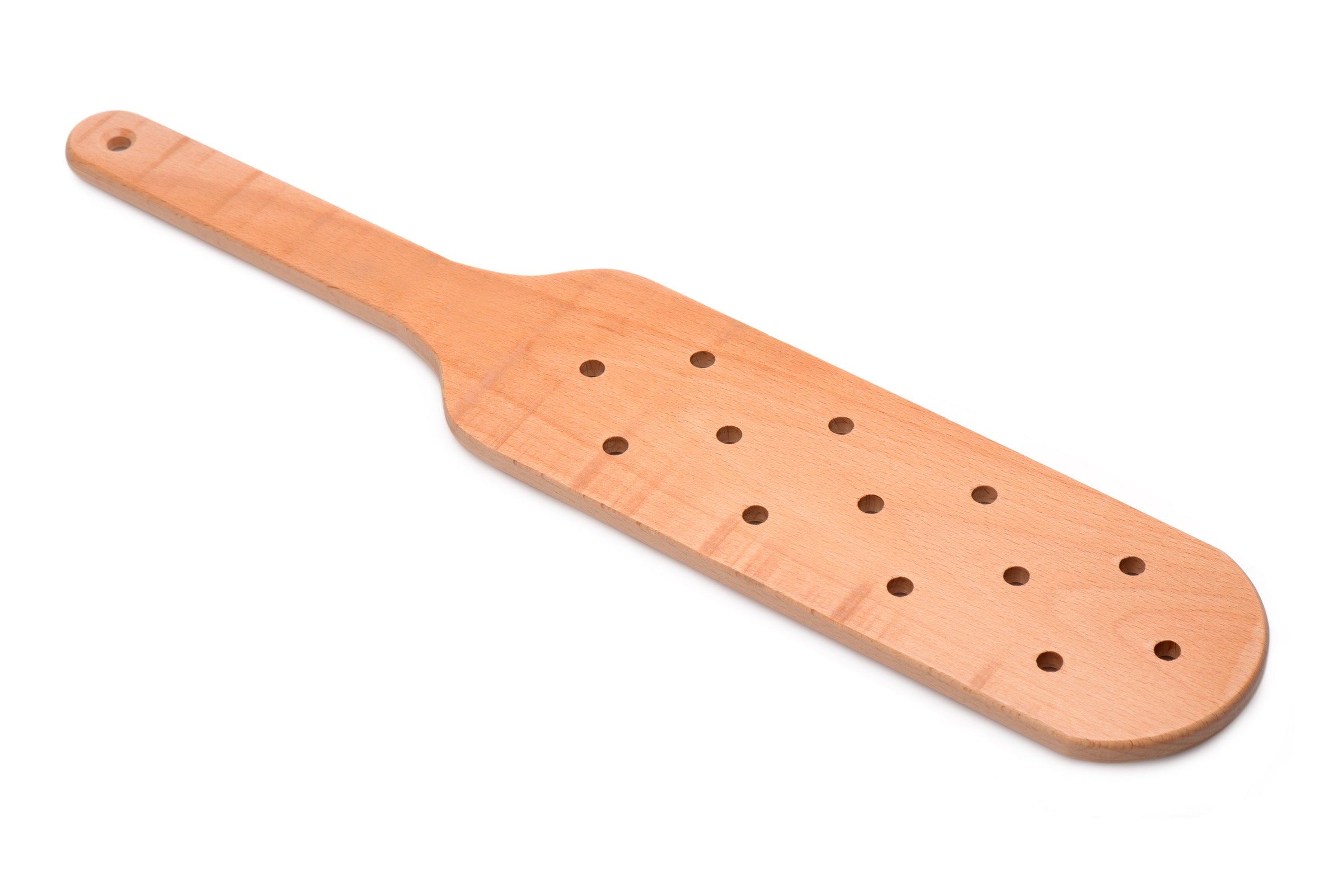 Close-up view of a perforated wooden paddle