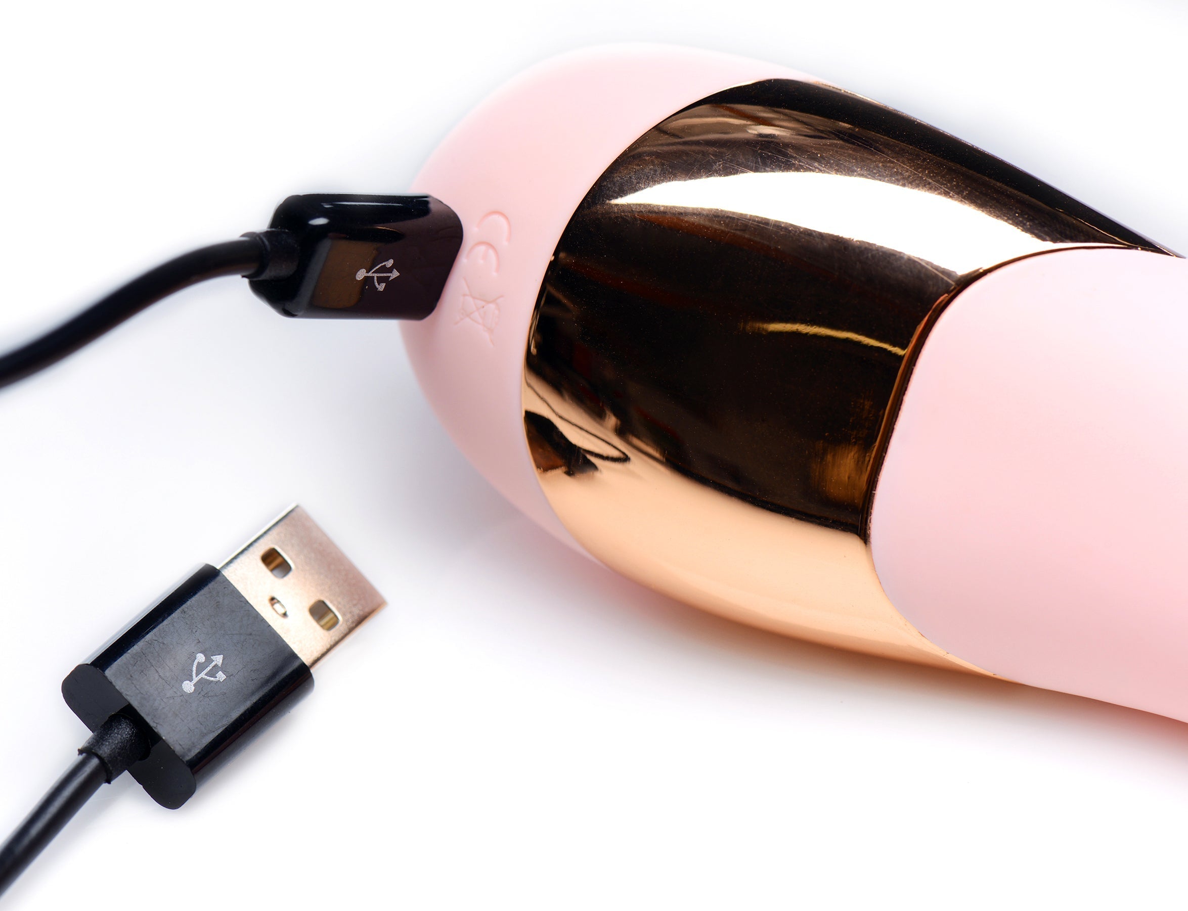 Shegasm Tickle Tickling Stimulator in pink and gold with an included USB charging cable