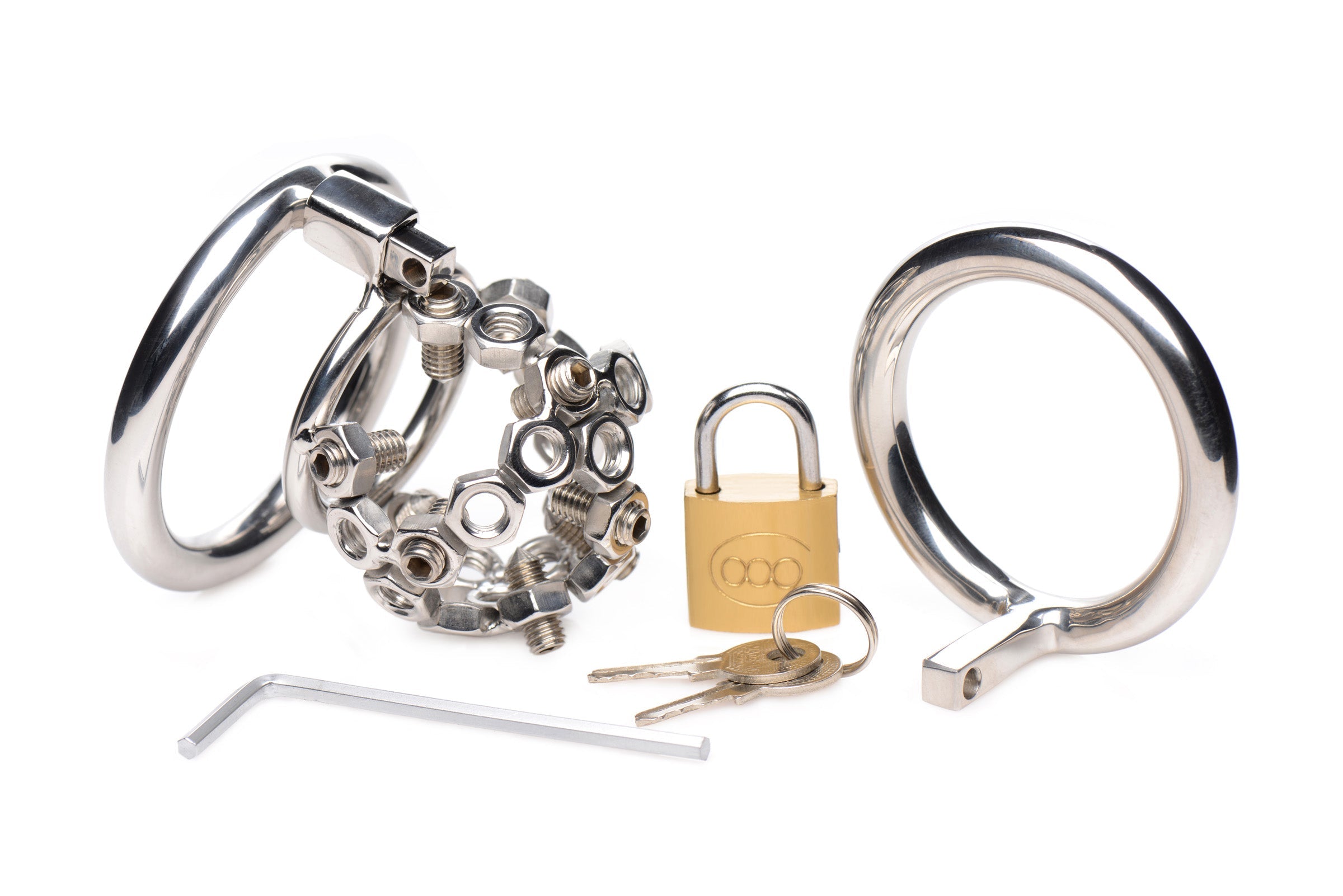 Disassembled parts of a chastity cage including metal rings and a padlock