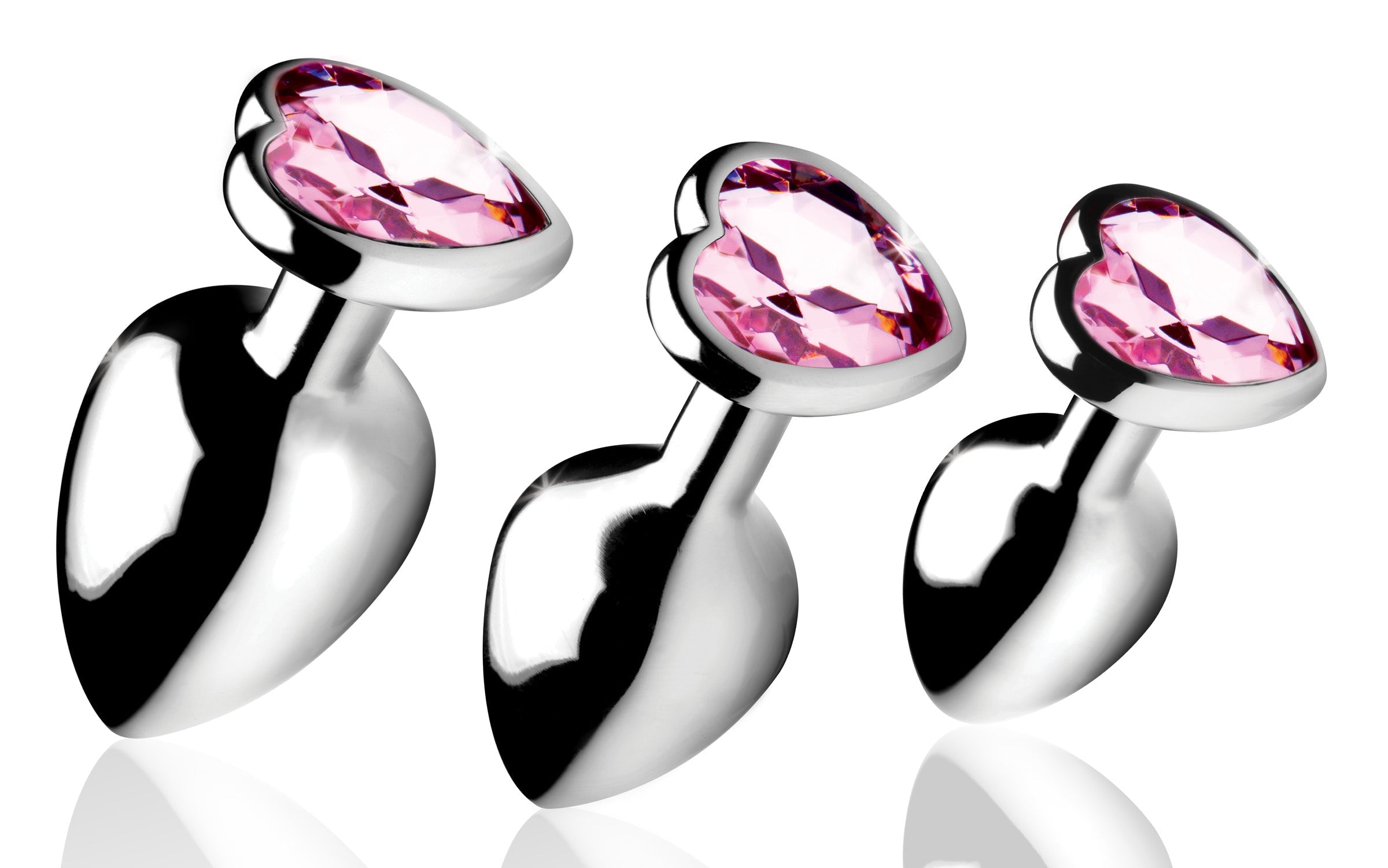 Set of three pink heart-shaped anal plugs with silver bases