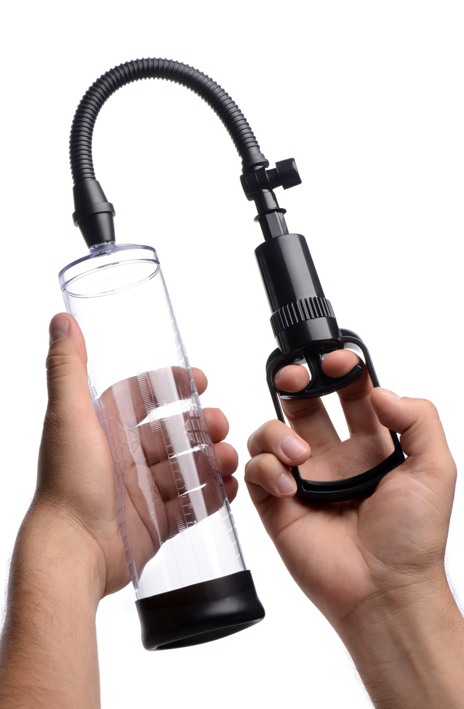 Hand demonstrating the use of the Trigger Penis Pump with a hose attachment