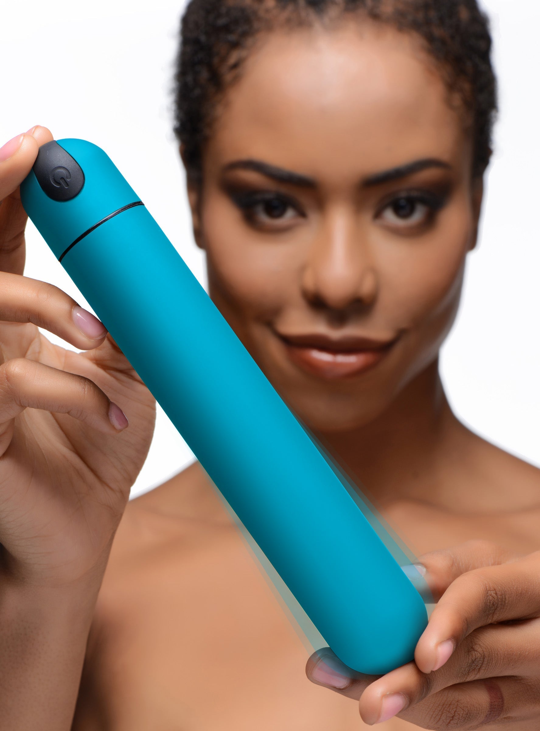 Hand holding the XL Bullet Vibrator in blue