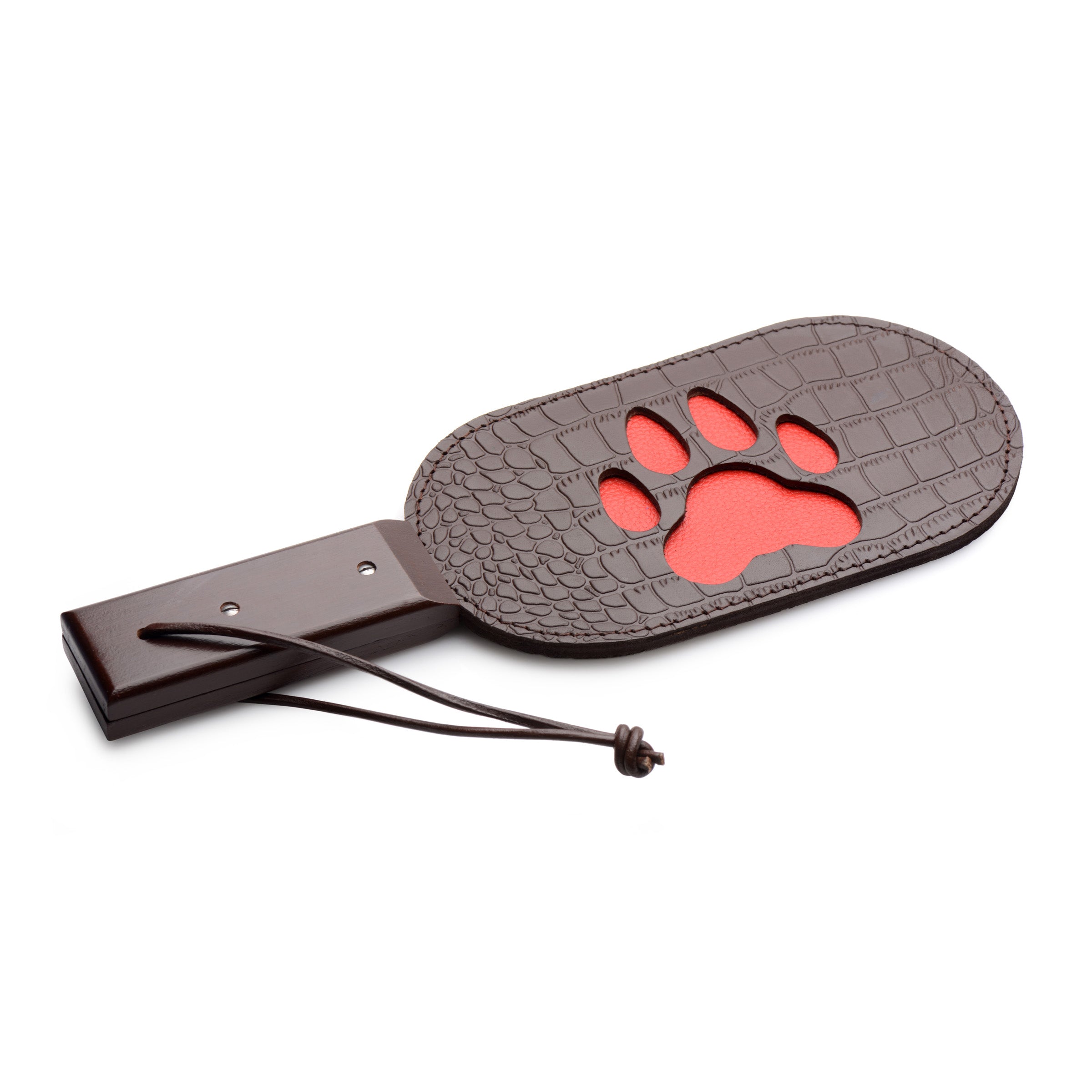 Close-up of a puppy paw-shaped leather paddle with a sturdy handle