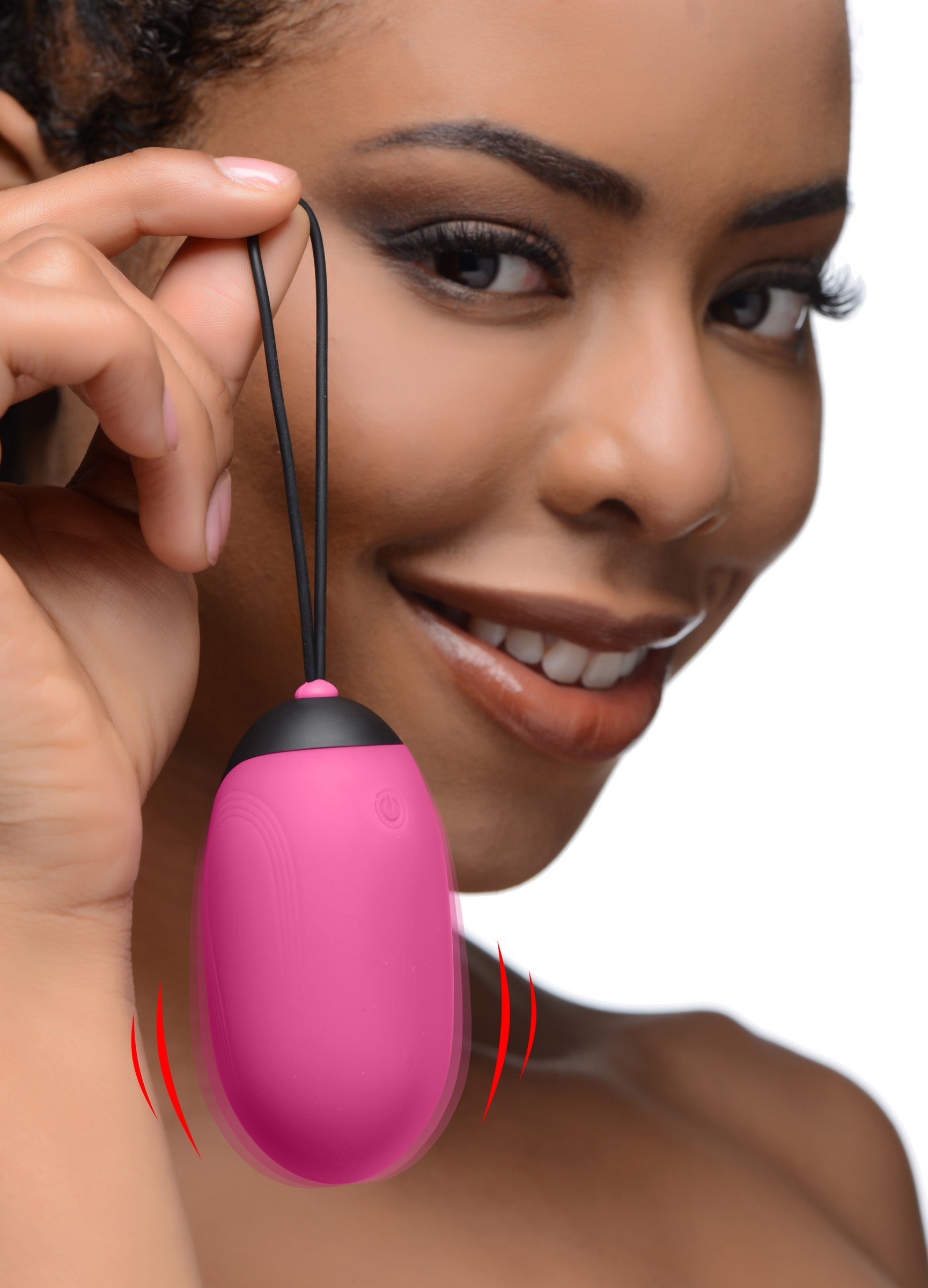 Pink XL Silicone Vibrating Egg showcased by a woman's hand