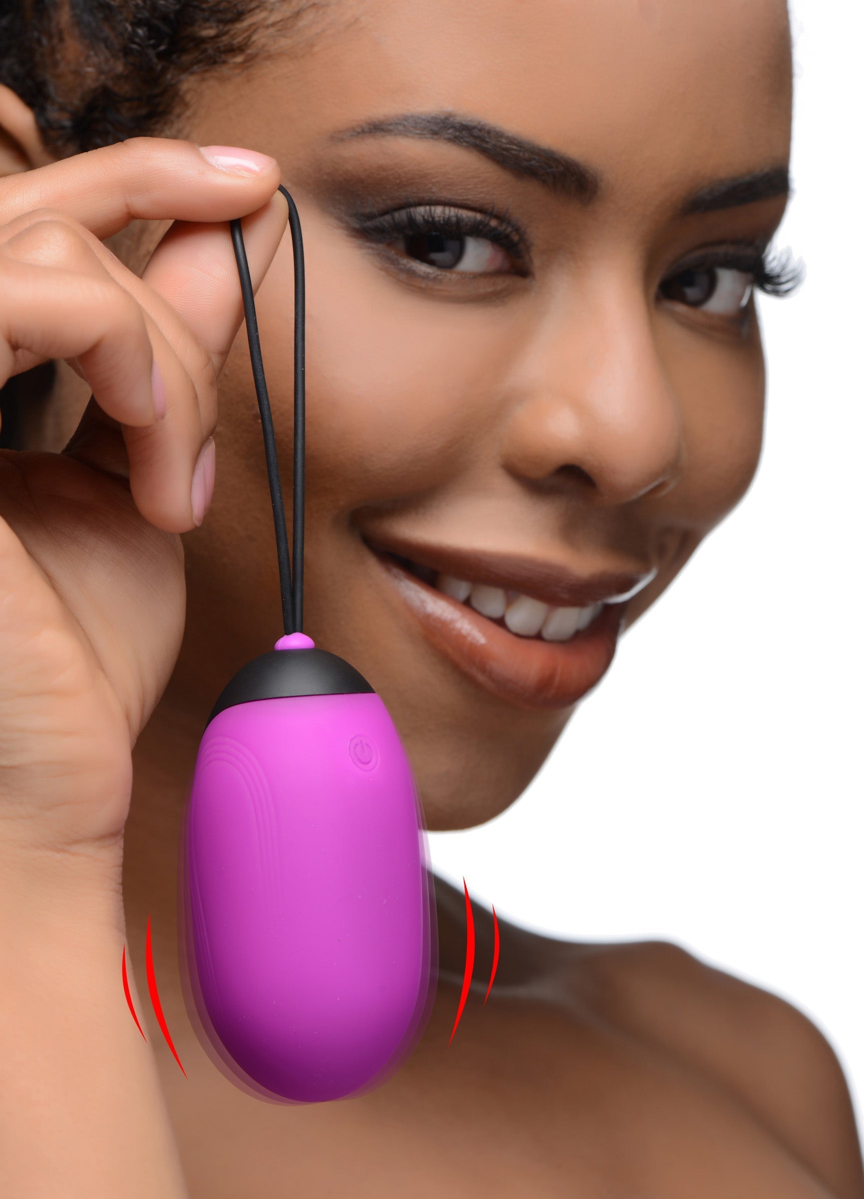 Purple XL Silicone Vibrating Egg held by a woman