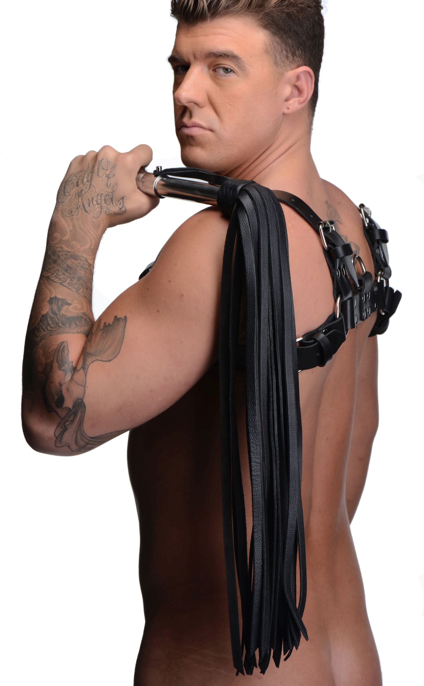 Close-up of a leather flogger with a stainless steel handle and intricate design