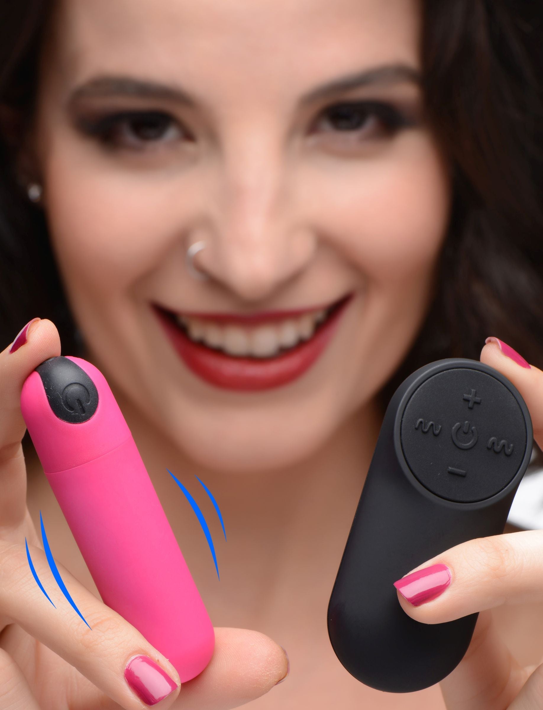 Woman's hand showcasing the functionality of the vibrating bullet's remote control