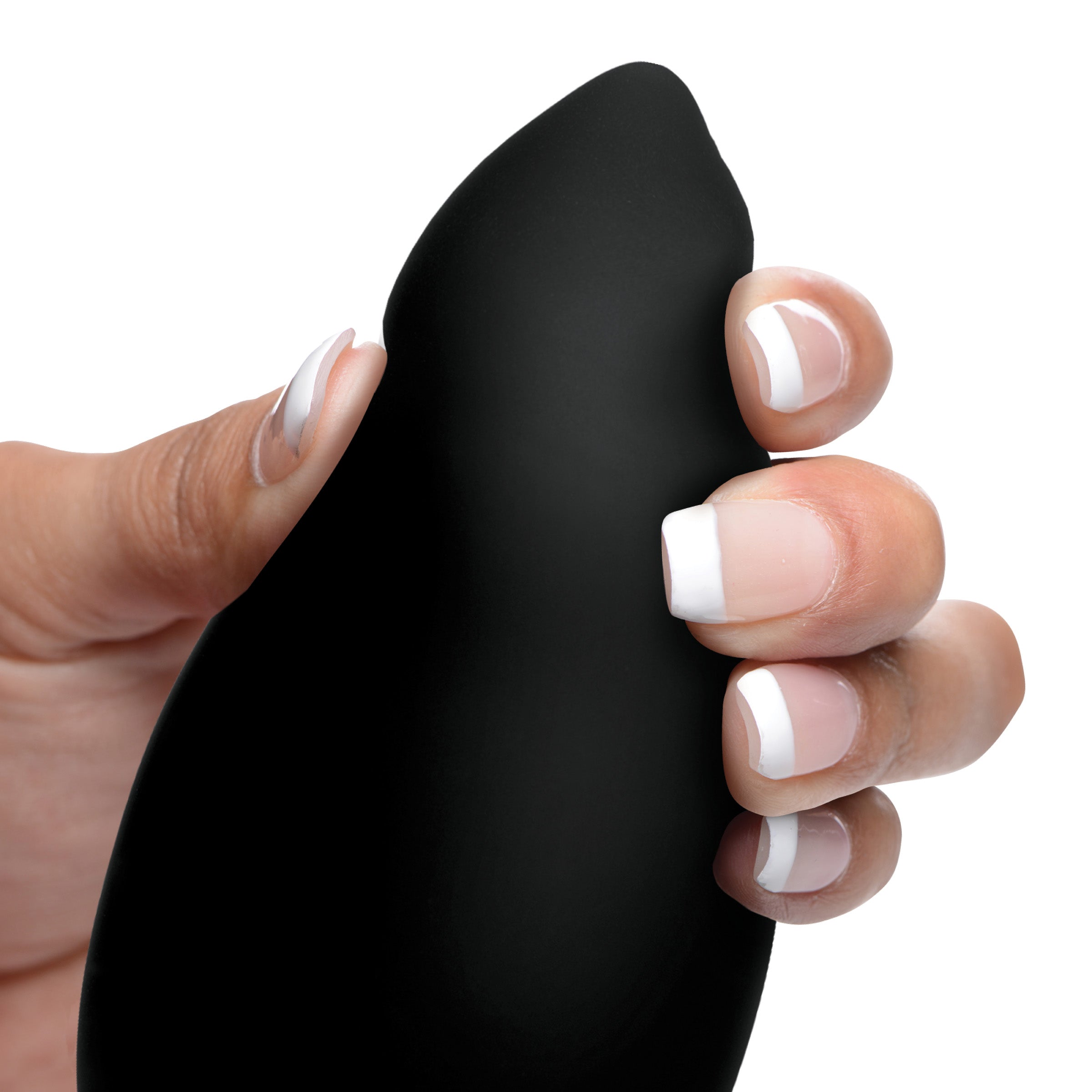 A woman's hand with white nail polish holding the Taper 10x silicone butt plug