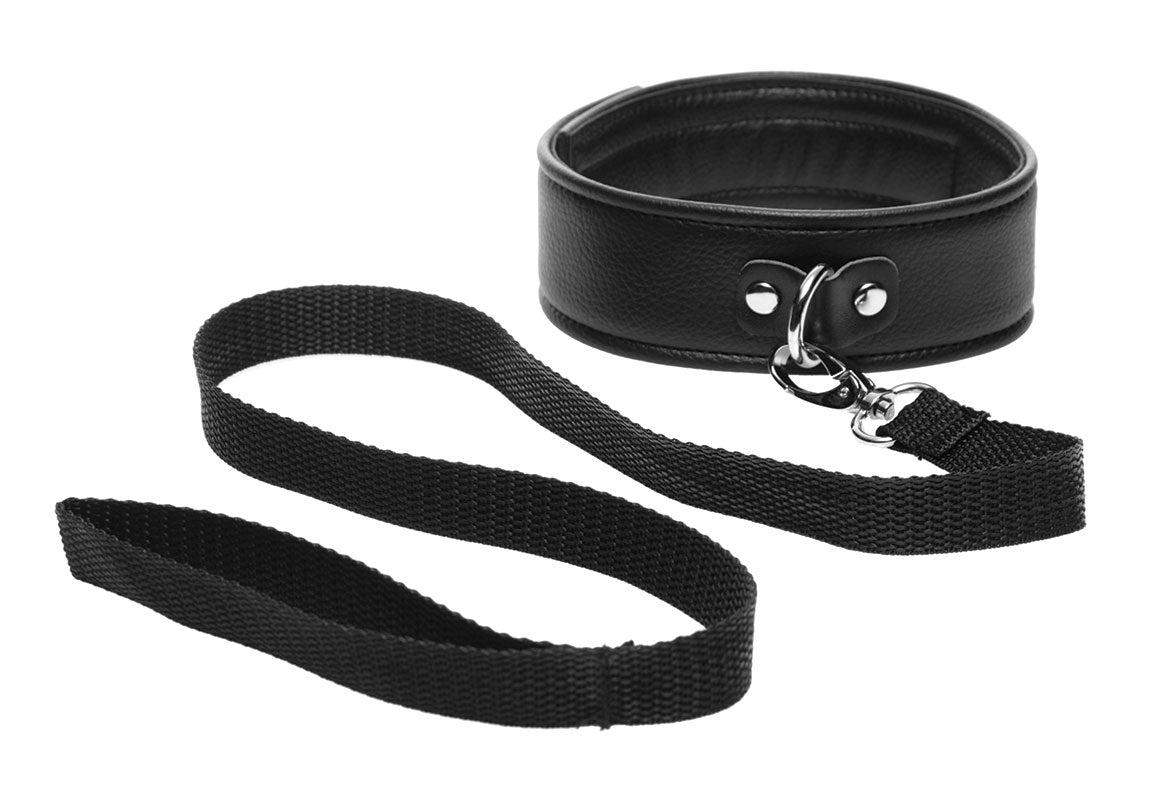 A black leather puppy collar with an attached leash for pet play