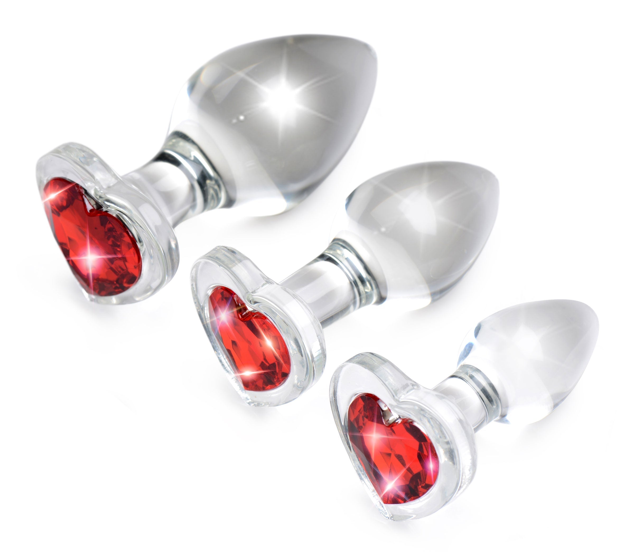 Set of three red heart-shaped glass anal plugs with gem accents