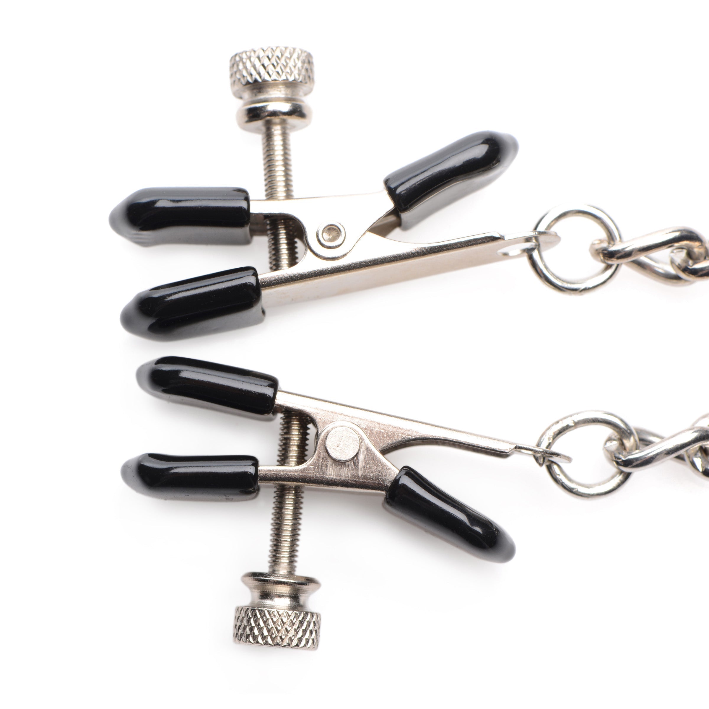 Detail view of the nipple clamps with silver hooks