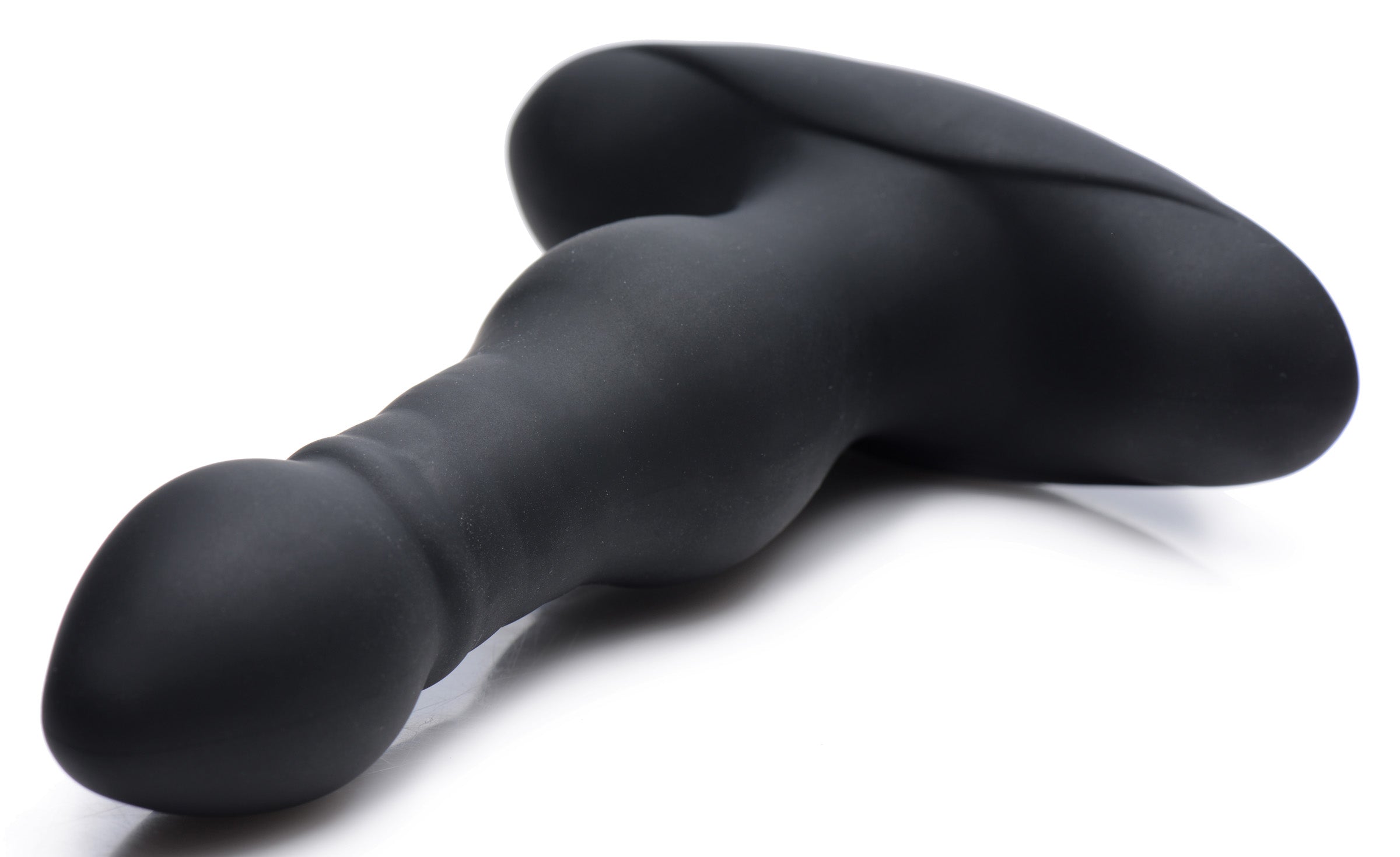 Black silicone vibrating anal plug on a white background