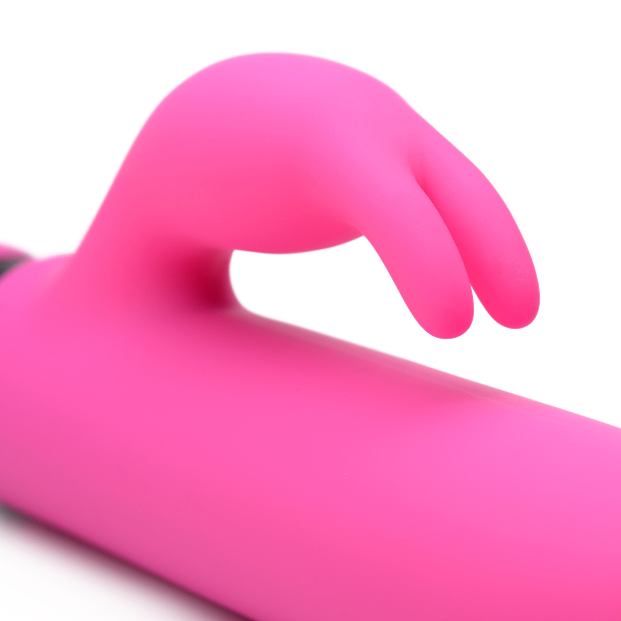 Close-up of a hand gripping the pink rabbit sleeve for the XL silicone bullet