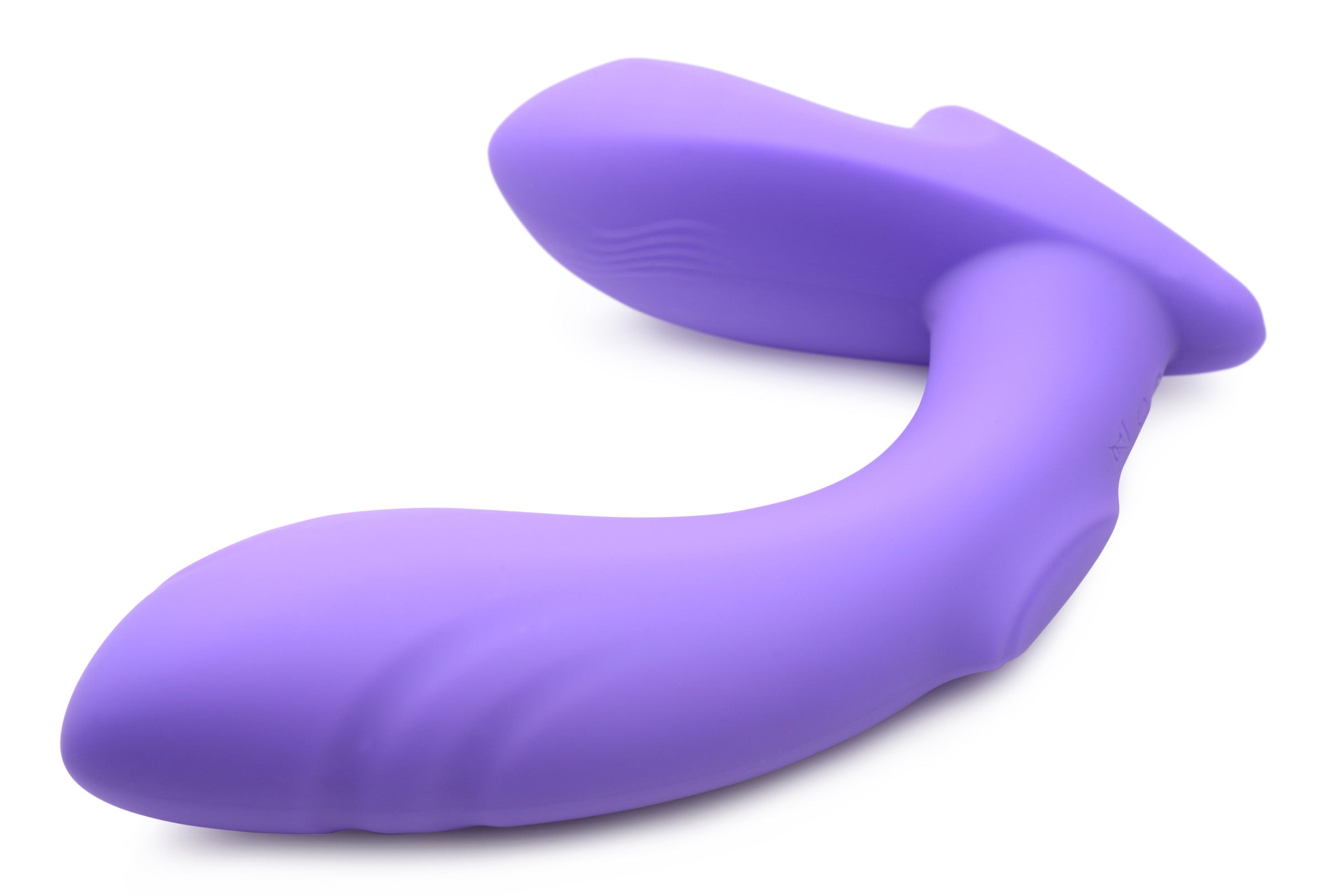 Close-up view of the 10x G-tap Silicone G-spot Vibrator on a white surface