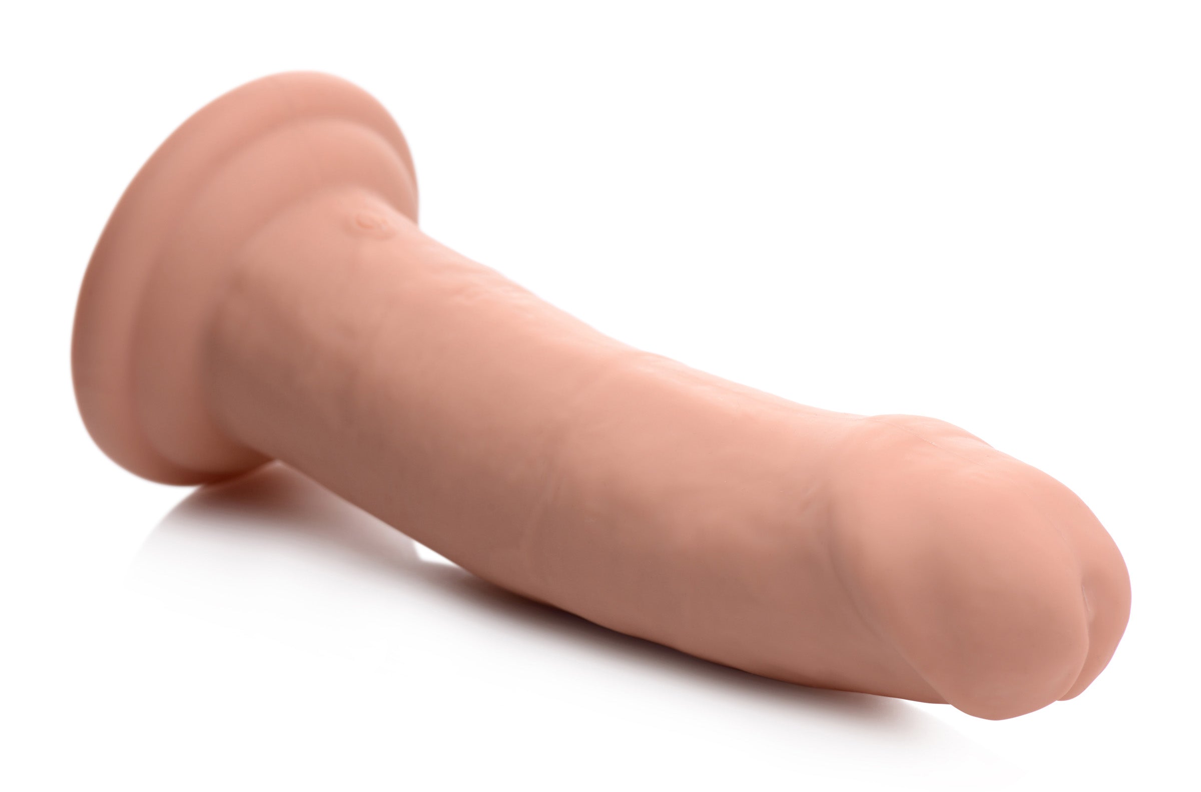 Inflatable silicone dildo with vibration and remote control on white backdrop