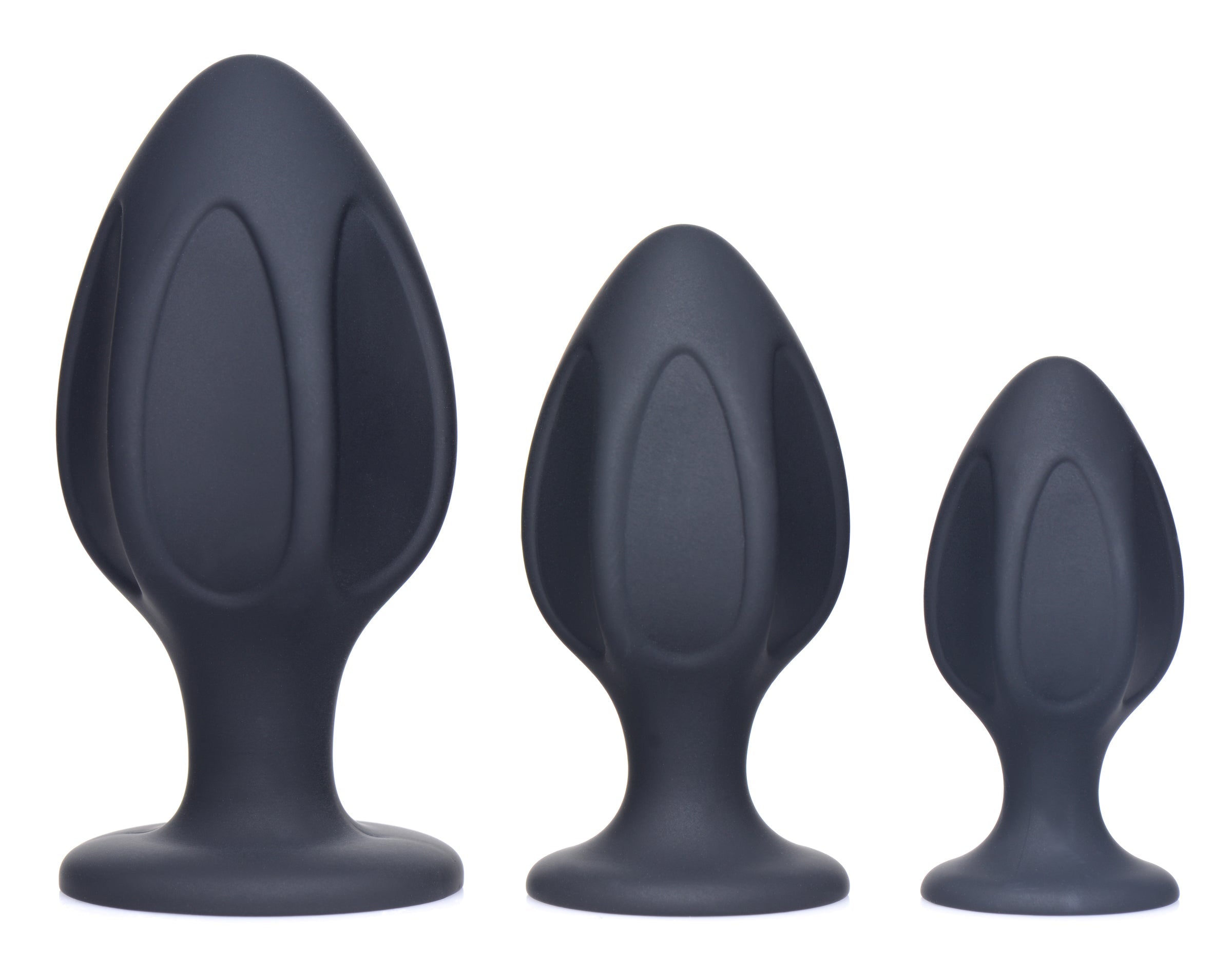 Silicone Triple Juicers Anal Trainer Set arranged on a white surface