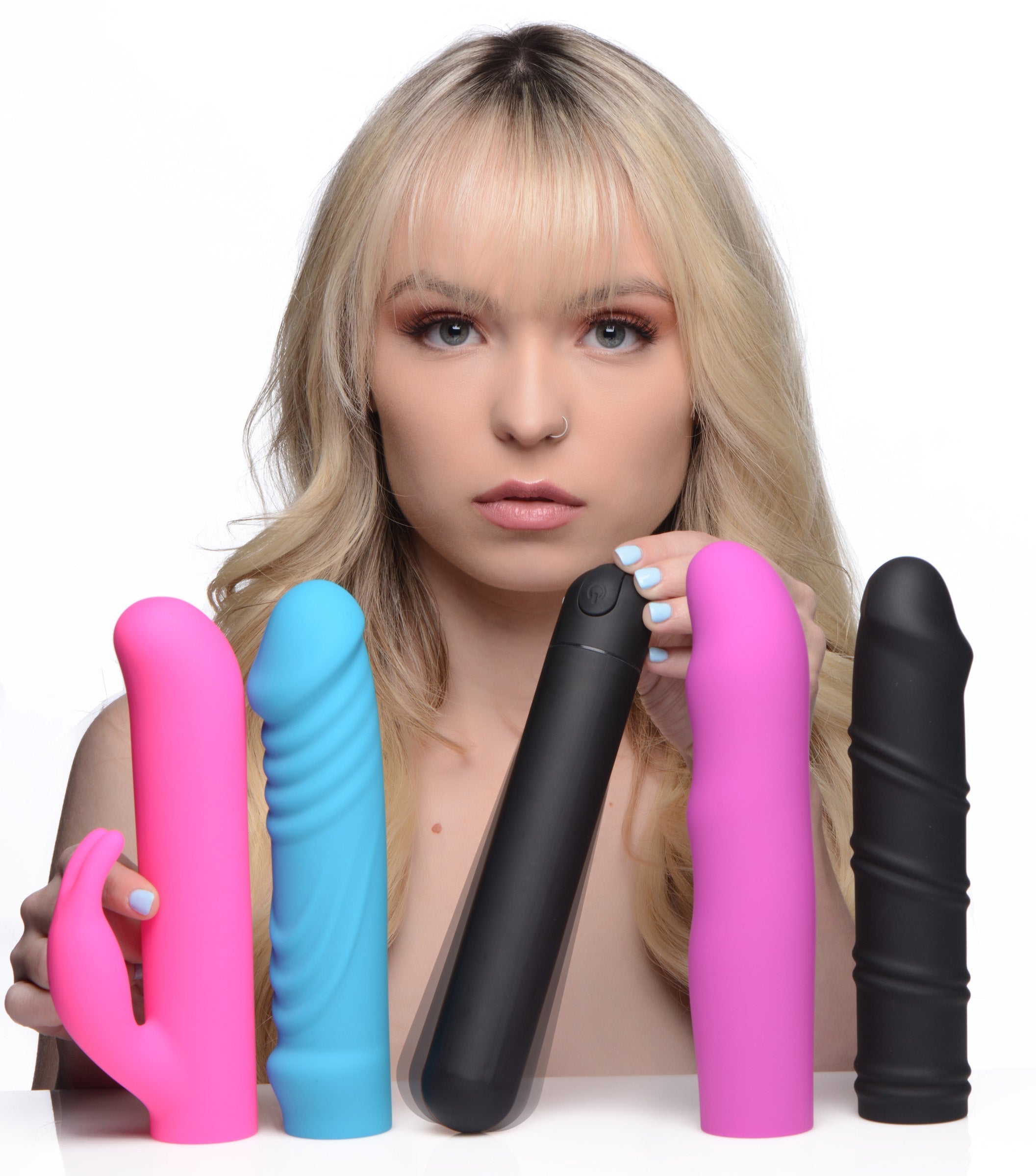 Person Displaying Four Silicone Sleeves from the Bullet Vibrator Kit