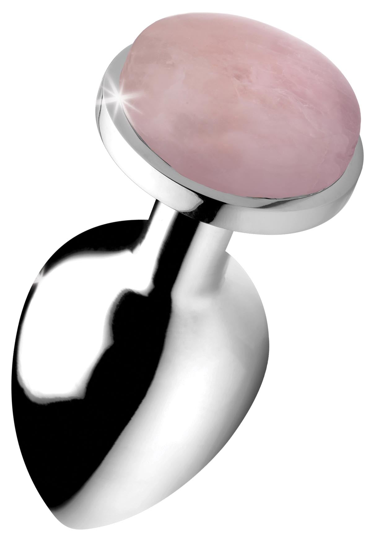 Polished rose quartz anal plug on a reflective surface