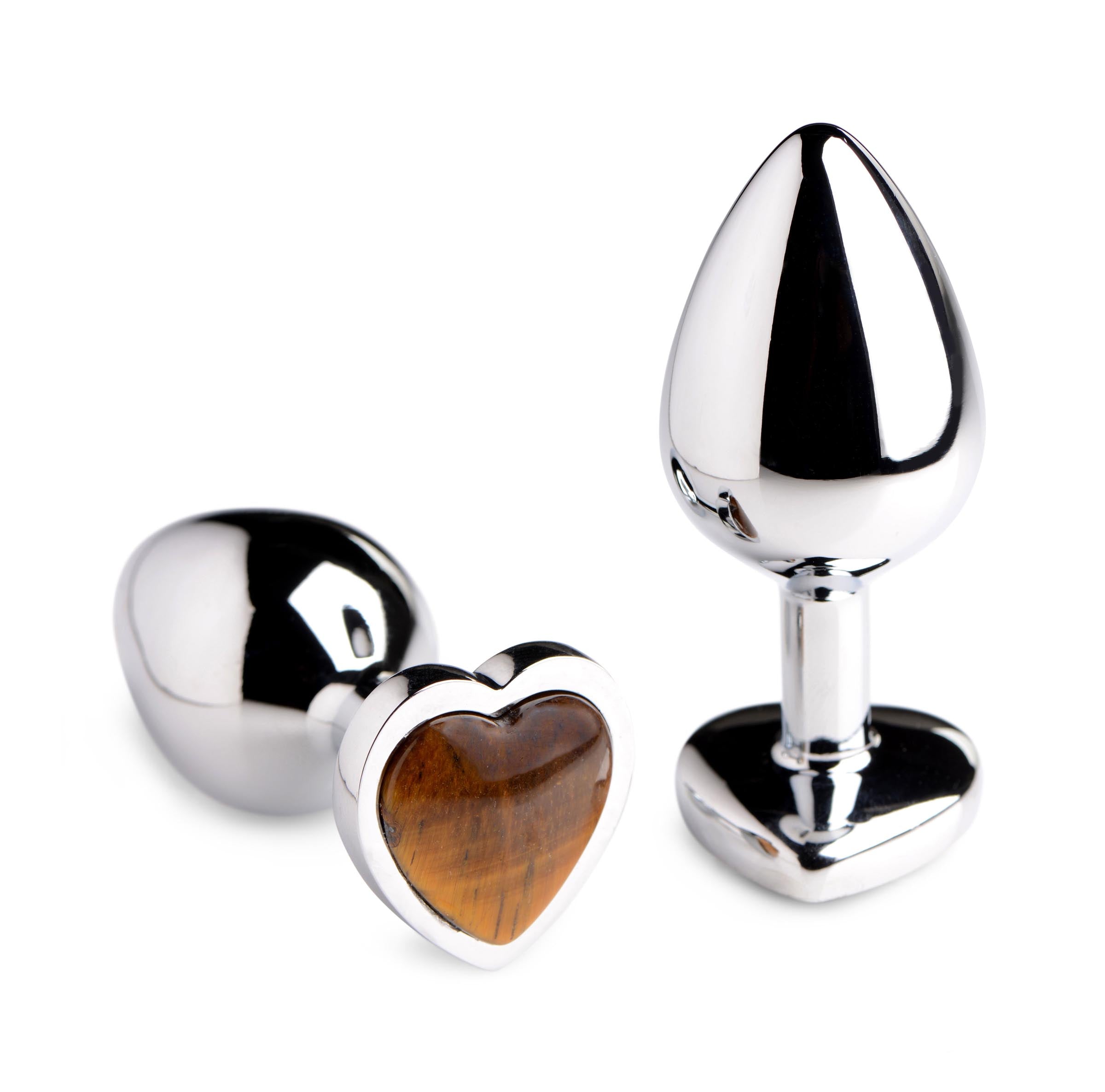 Two sizes of heart-shaped anal plugs featuring Tigers Eye gemstone insets